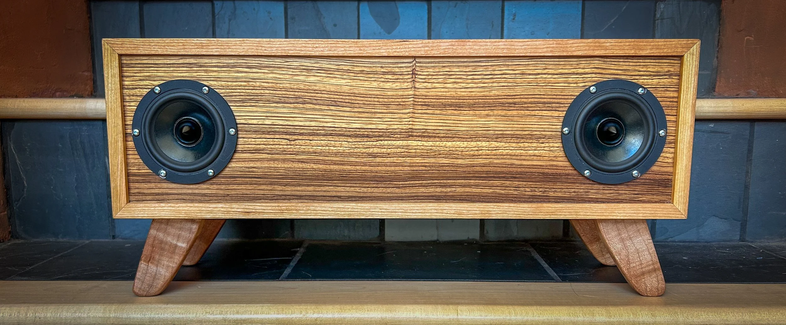 Portable Bluetooth speakers. Cherry and zebra wood