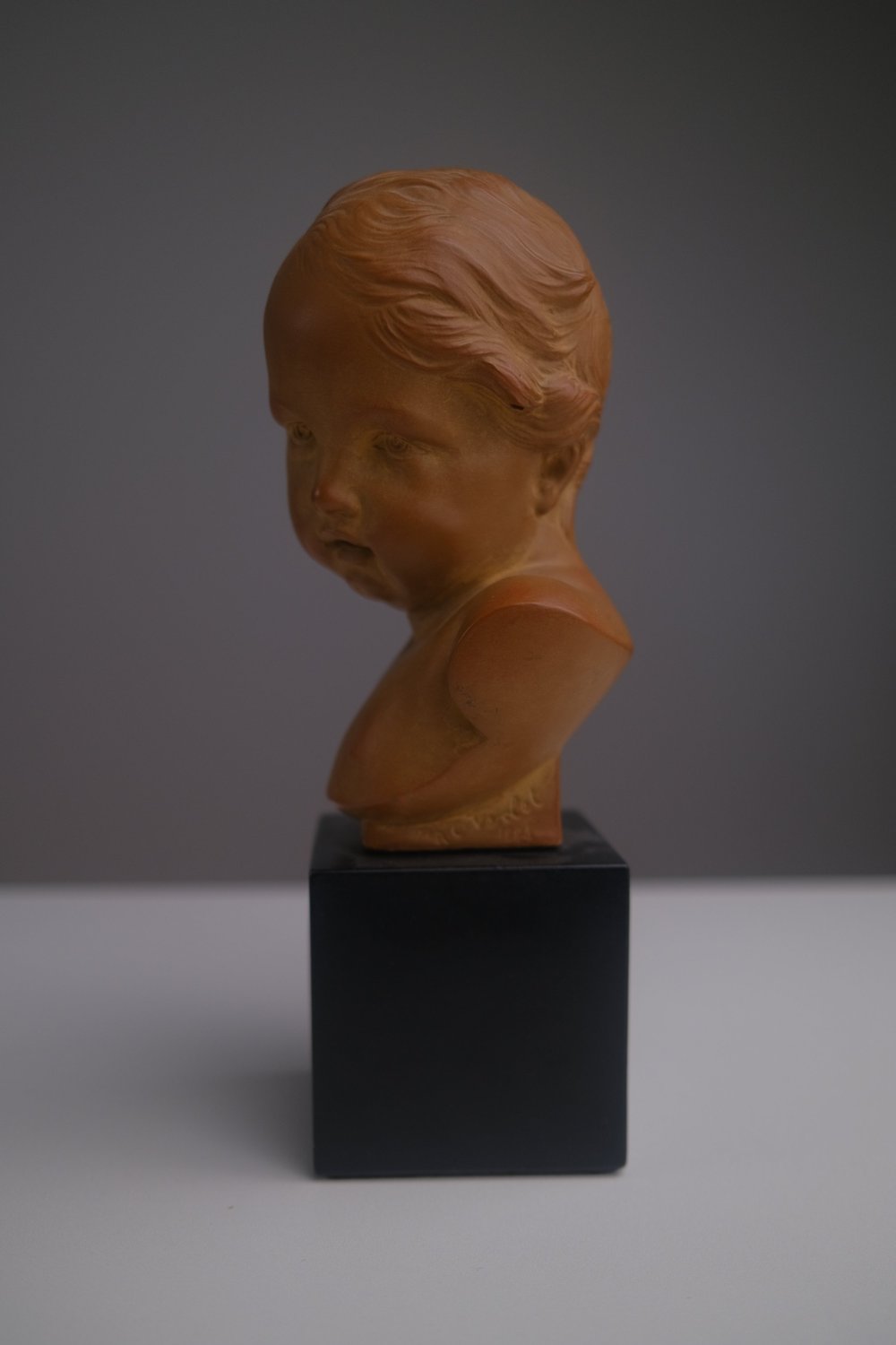 Bust of a Child in Red Terracotta Signed 1884 — Heritage Bureau