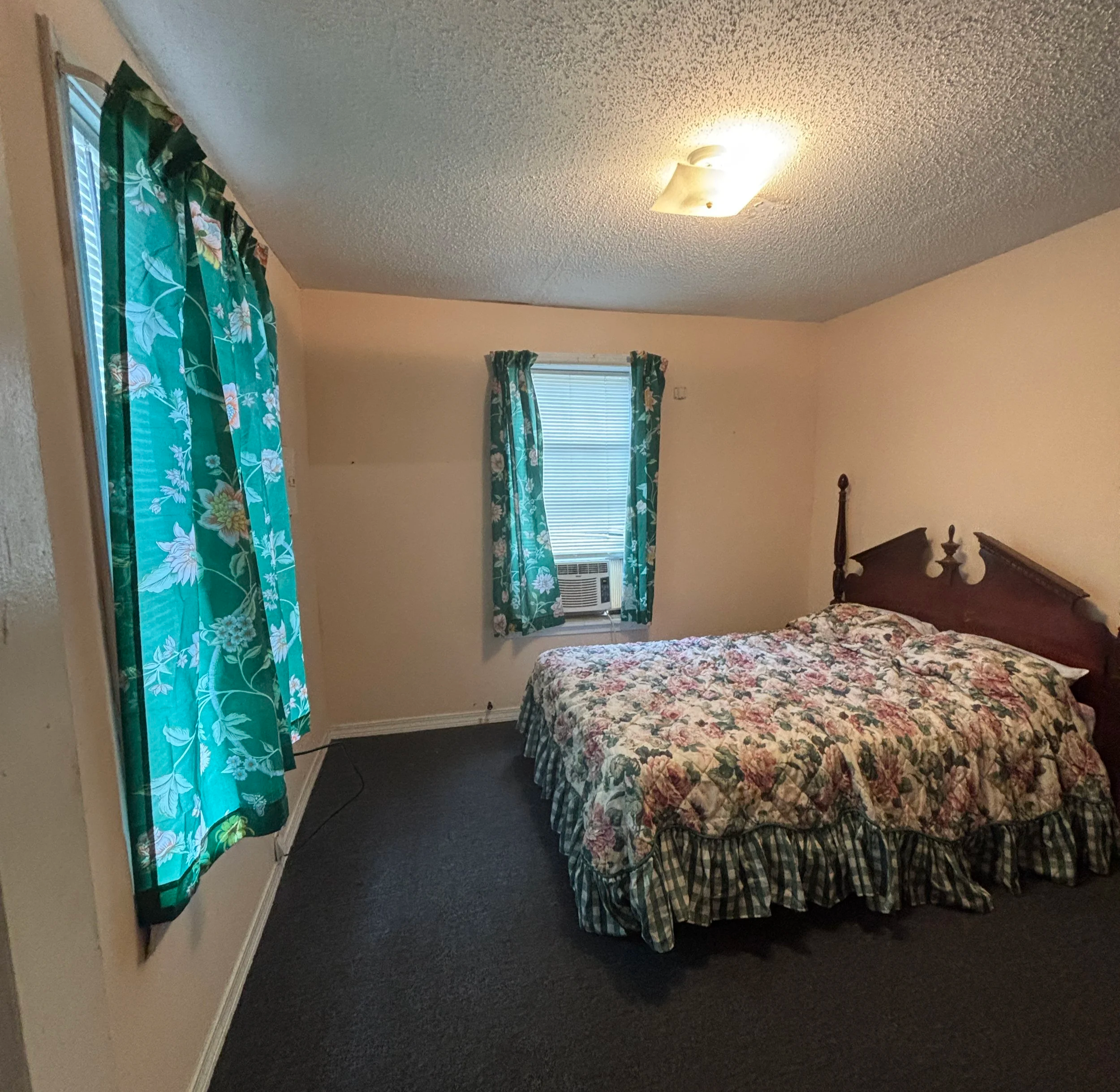 Primary bedroom with full bed