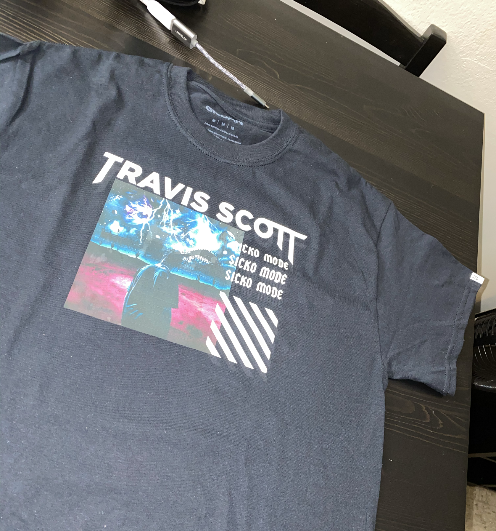 Gray tee with a Travis Scott graphic print