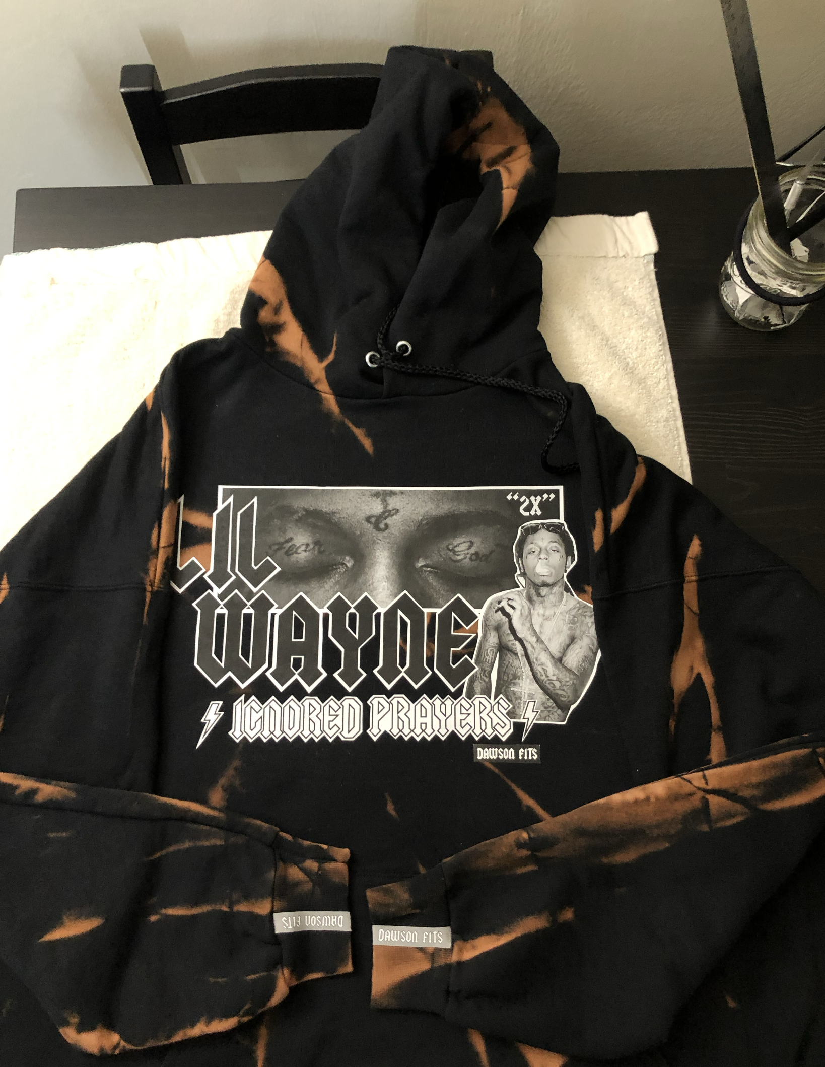 Bleached black hoodie with a Lil Wayne graphic print