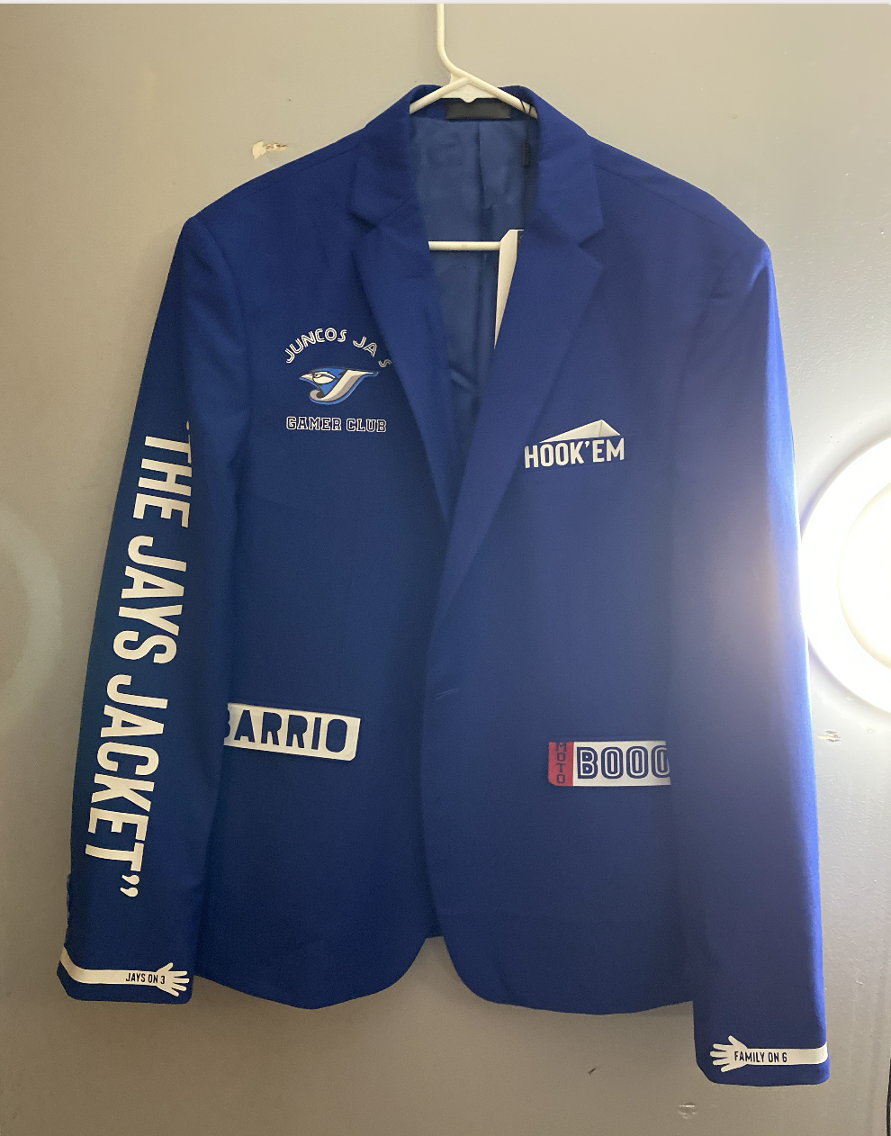 Custom royal blue blazer printed with "The Jays Jacket" down the sleeve