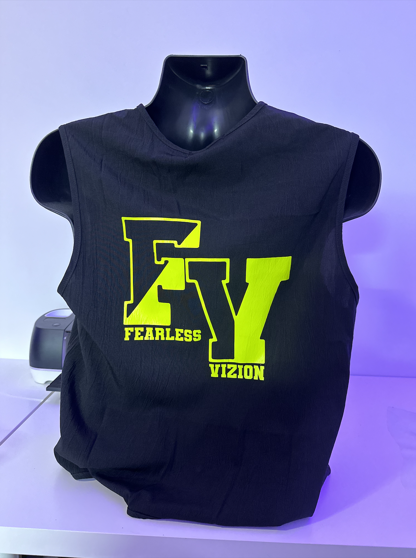 Black sleeveless tee with a neon yellow "Fearless Vizion" FV logo