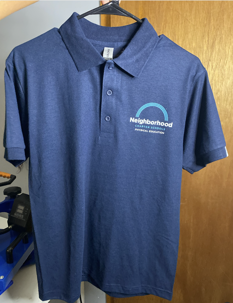 Navy polo shirt with a small embroidered company logo