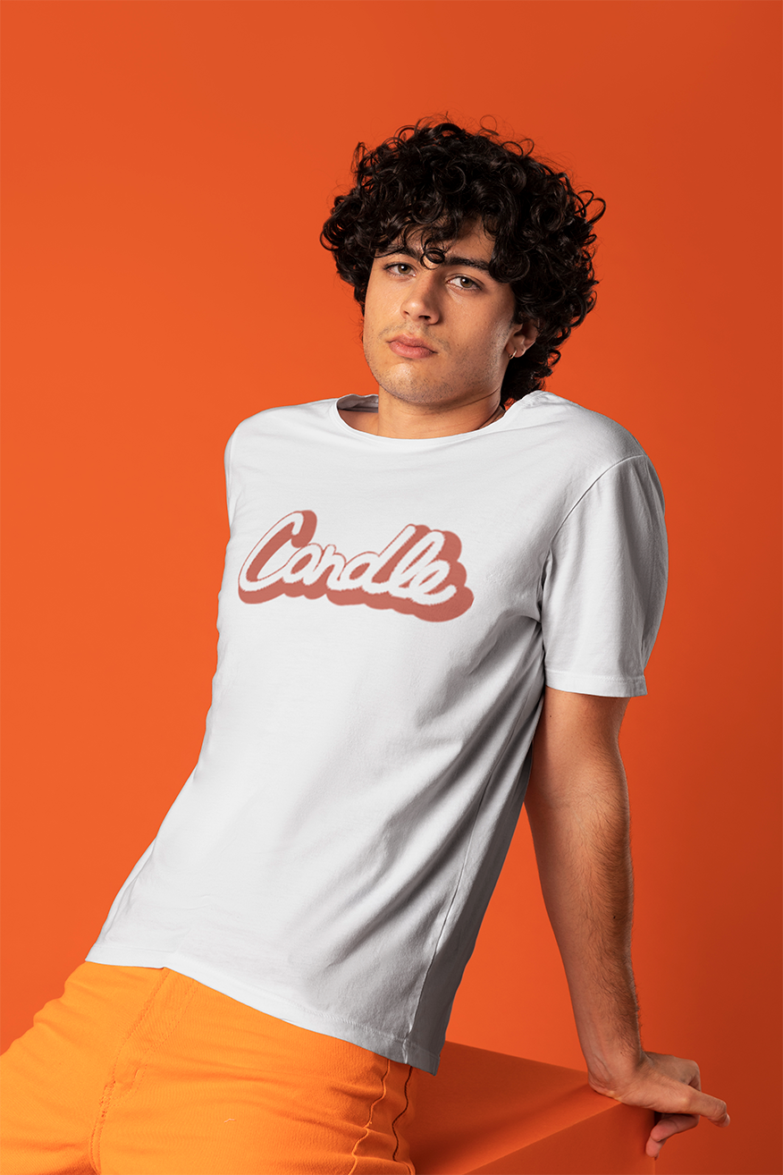 Model wearing a white Candle logo t-shirt against an orange backdrop