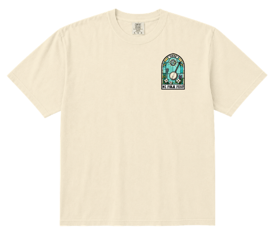 Cream tee with a small stained-glass banjo pocket print for NC Folk Fest