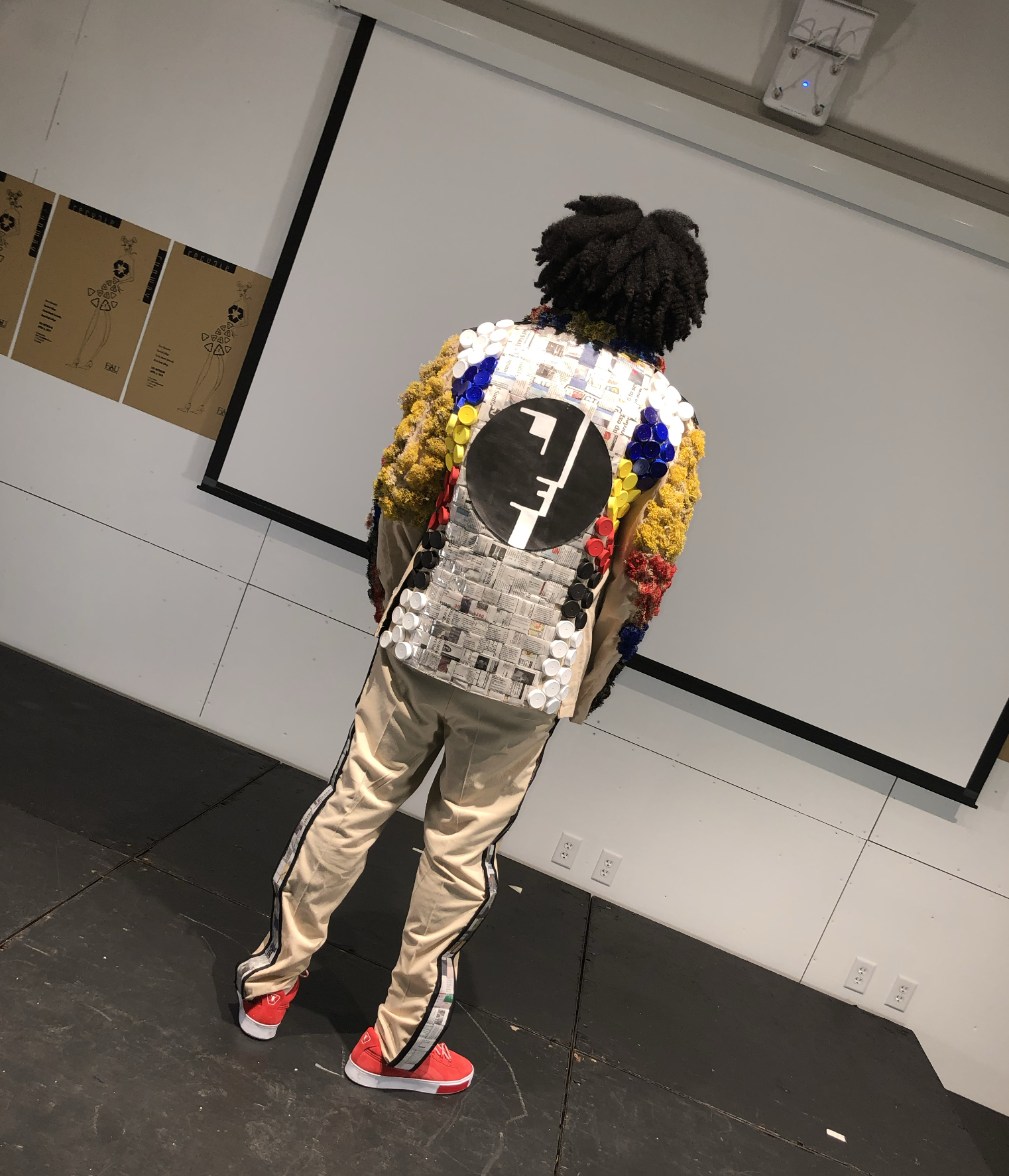 Back view of a model in a custom printed patchwork jacket