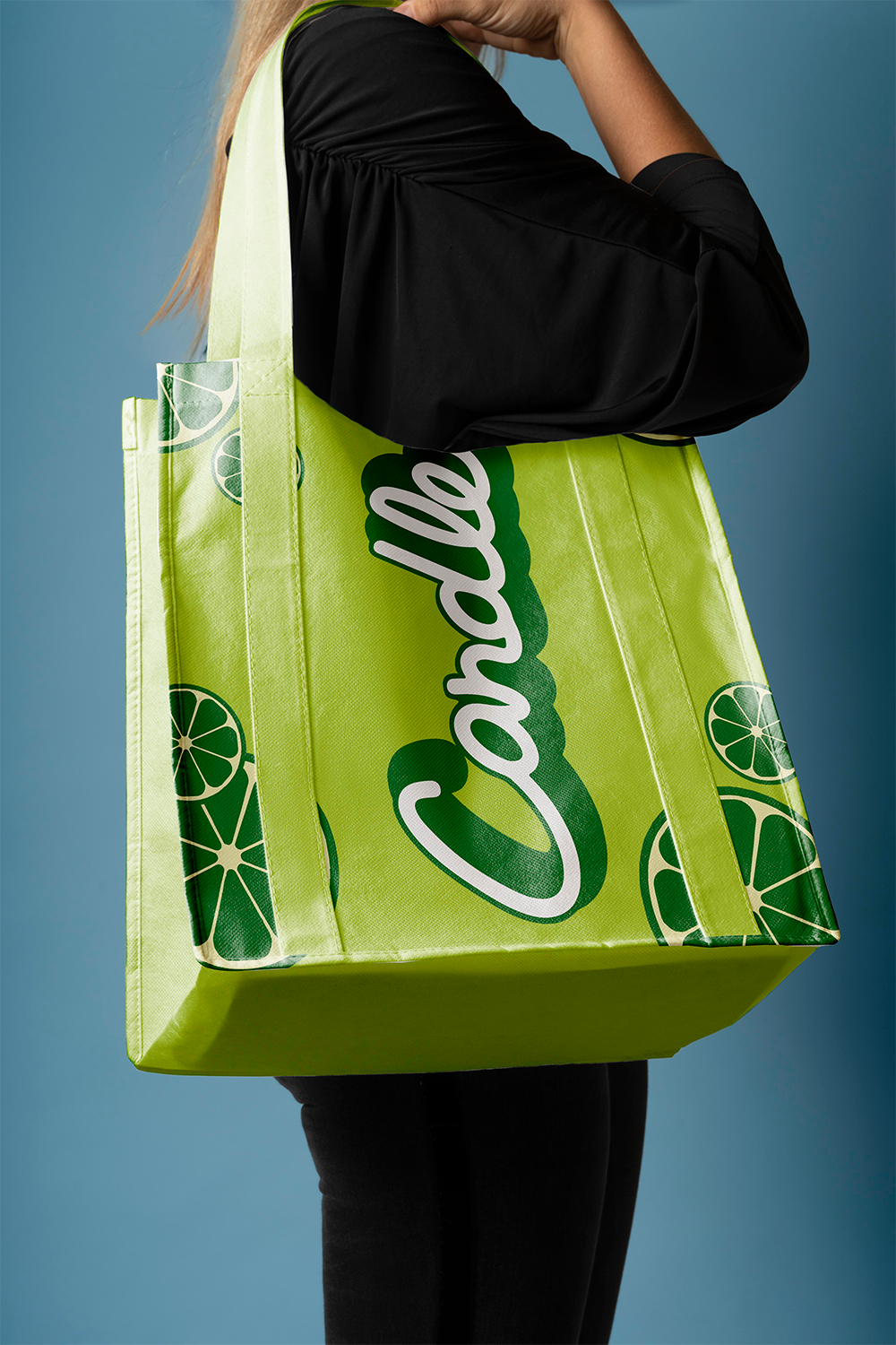 Person carrying a lime-green Candle tote bag