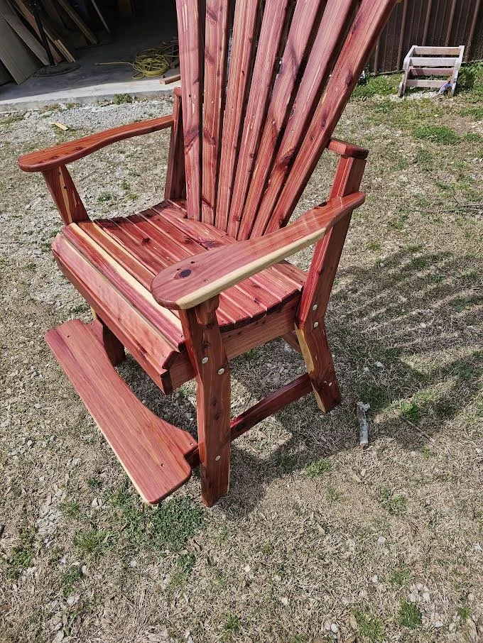 Handcrafted cedar Adirondack chair with an extra‑wide seat, built by JD’s Woodshop in Alabama for outdoor comfort and durability.