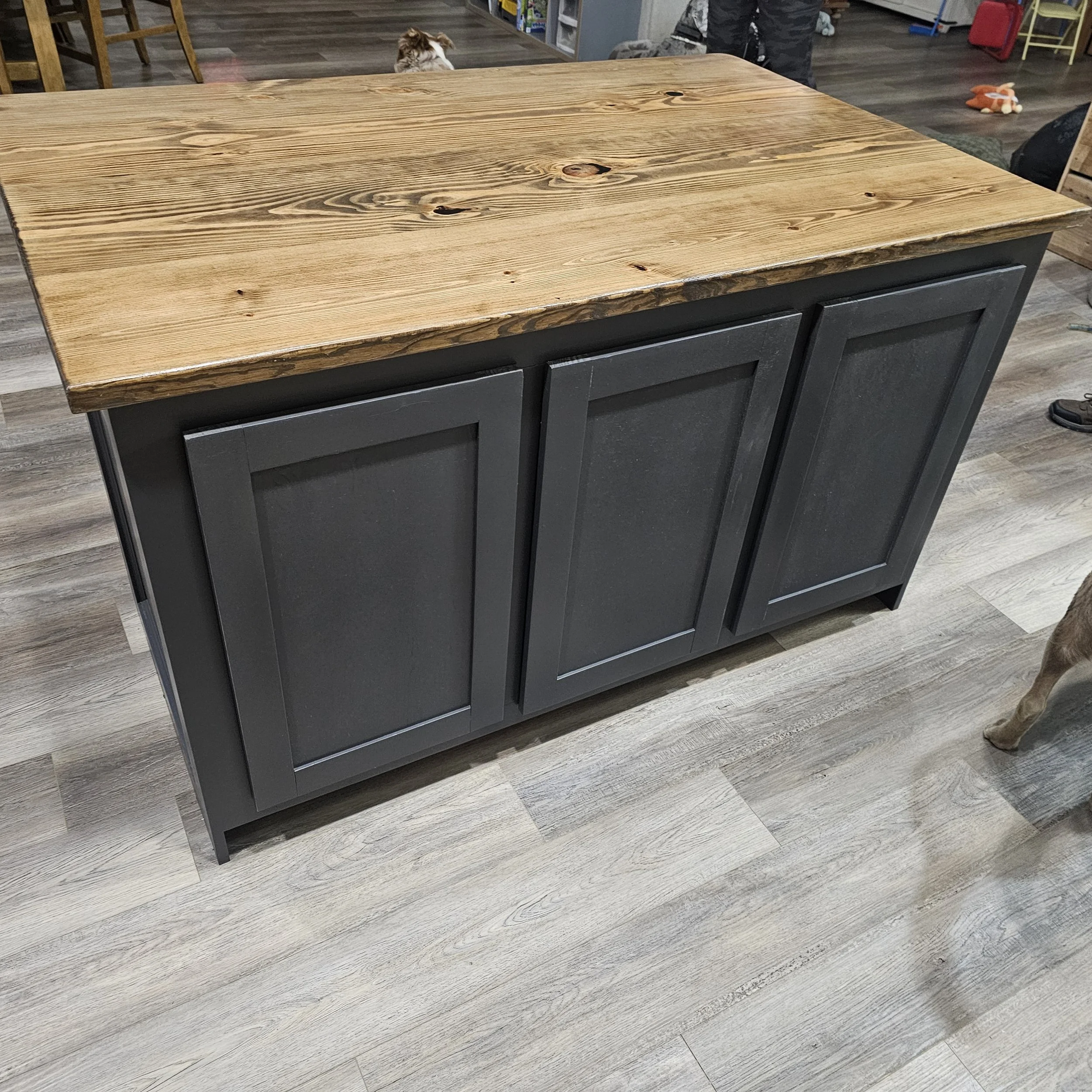 Custom handcrafted wood kitchen island with natural butcher‑block top and shaker‑style base by JD’s Woodshop
