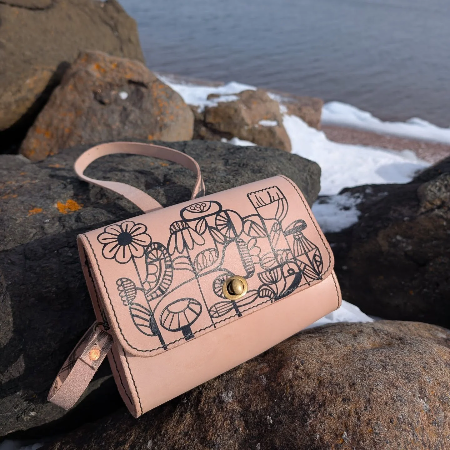One thing that I've been playing with is the idea of being able to draw/doodle on leather. This was my first bag that I designed with this in mind. With a somewhat abstract floral design, I think this bag has a pretty cool and unique look! 
It'll be 