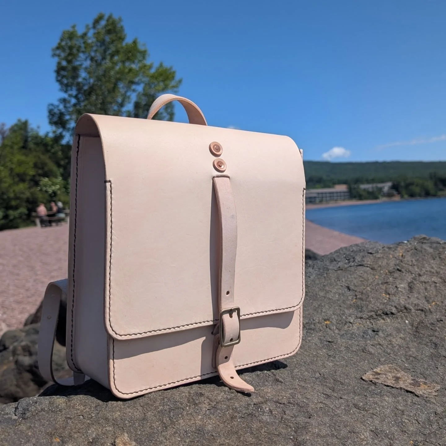 My newest pattern and creation- a backpack! Featuring two pockets, one with a zipper, and a dark contrasting thread that will start to blend in as the leather darkens. 

This one will be for sale at the Grand Marais Art Fair, but I am definitely goin