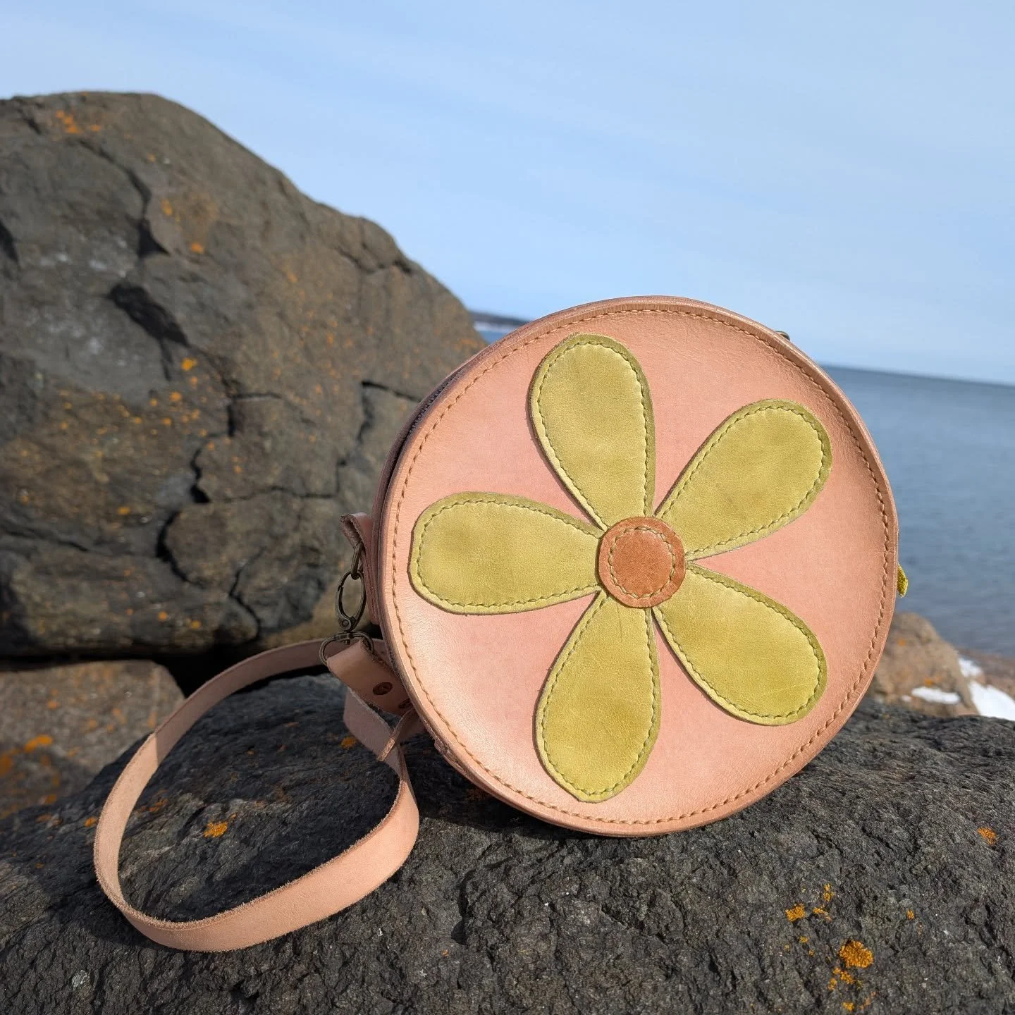 The Daisy Bag, one of my very personal favorite designs. Using found scrap leather for the flower design, this pattern allows for every bag to be slightly unique. I'll have six of these available at the Grand Marais Art Fair, all in different color c