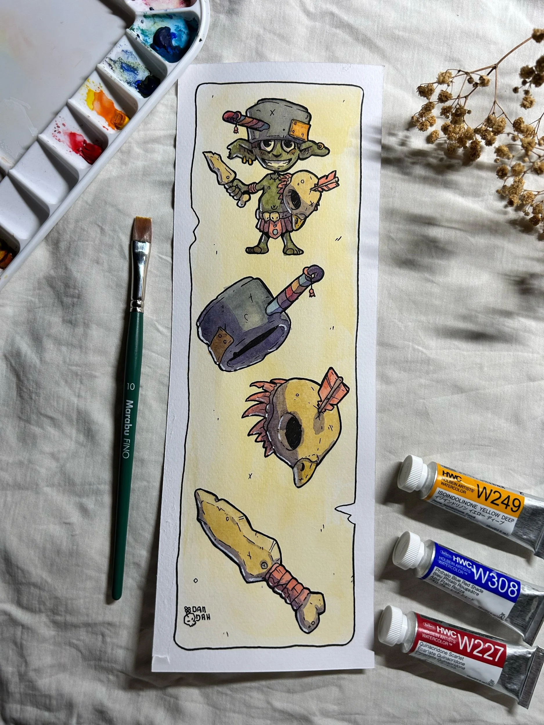 Goblin swordsman with a pot helmet, hammer, feathered mask and sword, ink and watercolor art beside paint tubes.