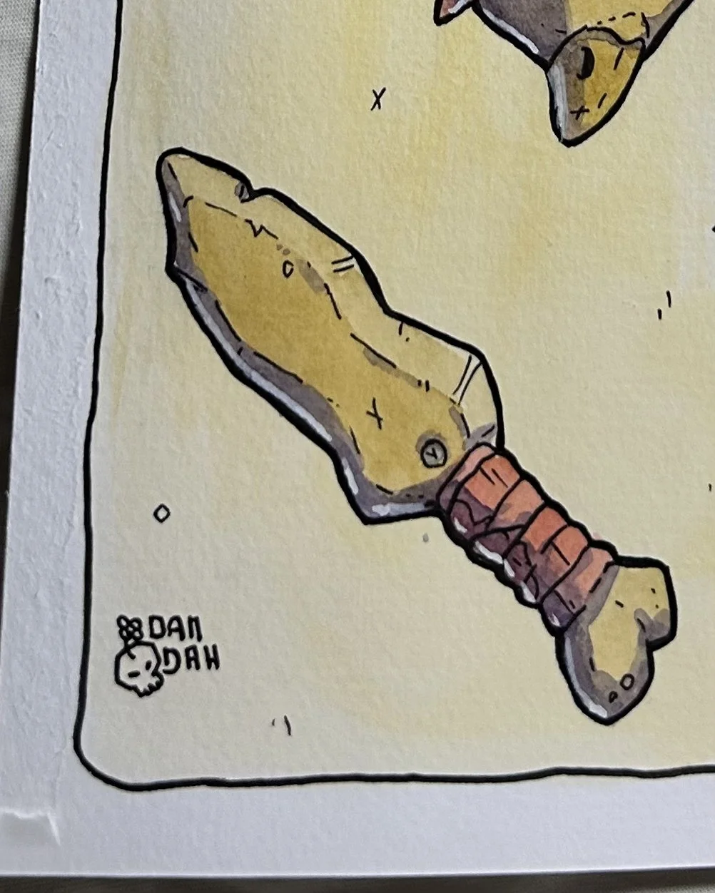 Stone sword with a red wrapped grip, close-up of a goblin illustration in ink and watercolor on paper.