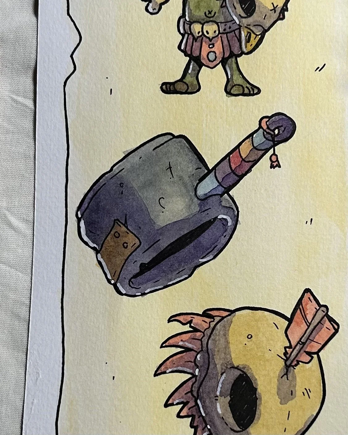 Dark pot-shaped hammer and a feathered yellow mask, close-up of a goblin illustration in ink and watercolor.