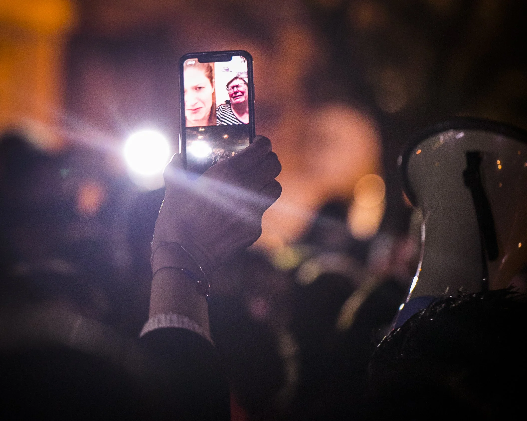 A mother and another relative, present online during a vigil dedicated to her own murdered daughter