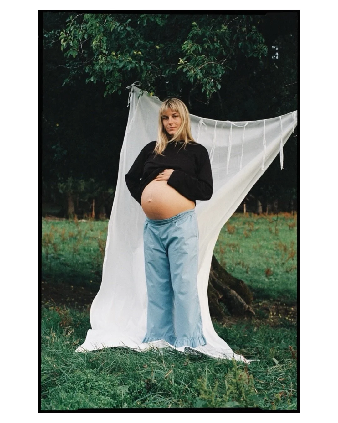 L. in the meadow, in full bloom. Wearing the Ruffle Pants. The deer said hello. Felt a little too dreamy to be true.

As part of Lille.studio I picked up the camera to document mothers and families again &mdash; unhurried, outside whenever possible. 
