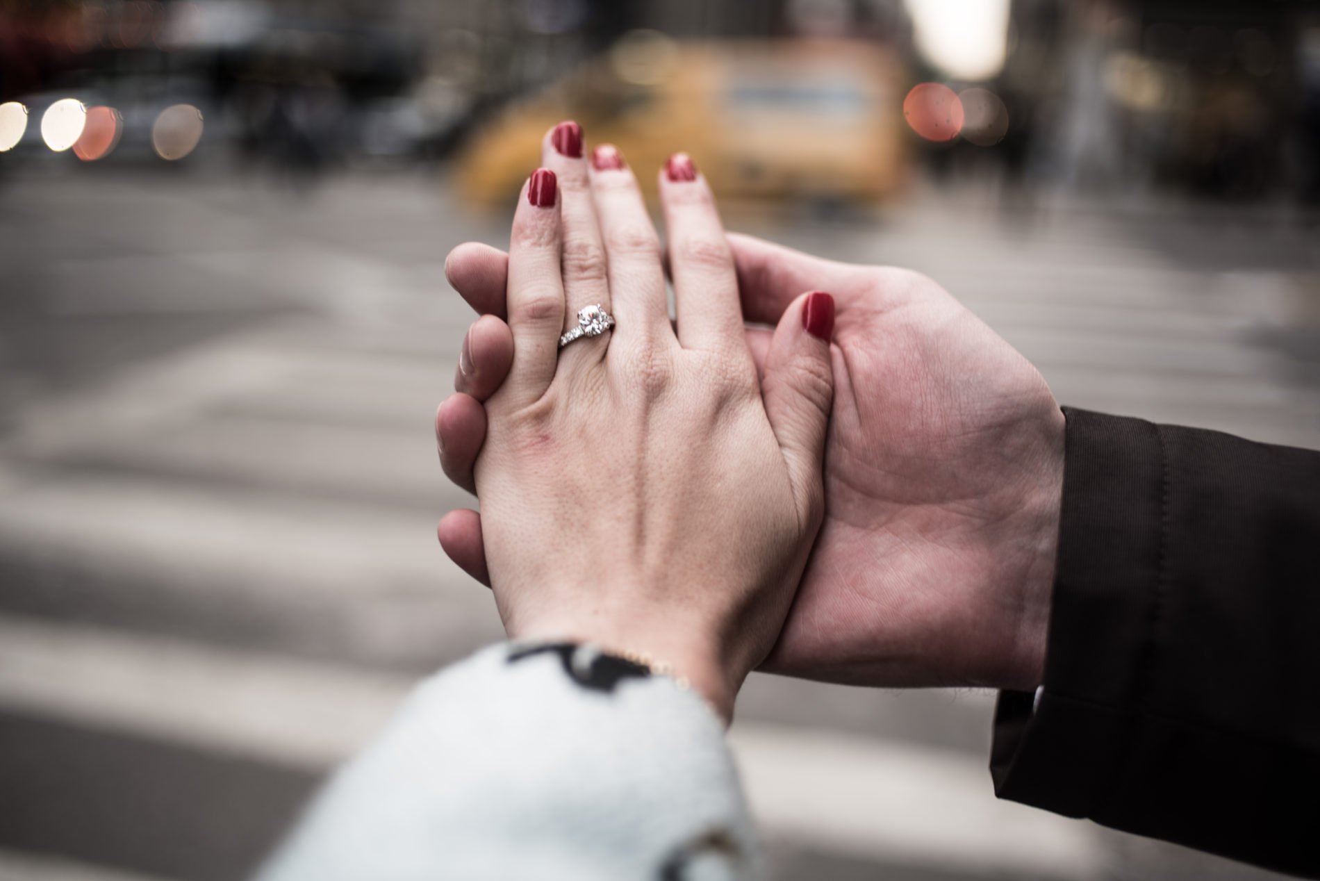 Detail of the hands of a newly engaged couple.