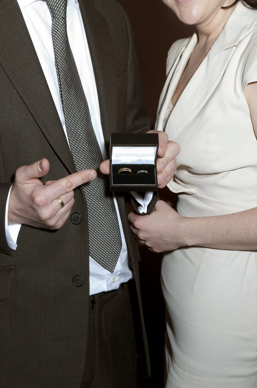 City Hall Couple from London for winter wedding shows off their wedding rings. 