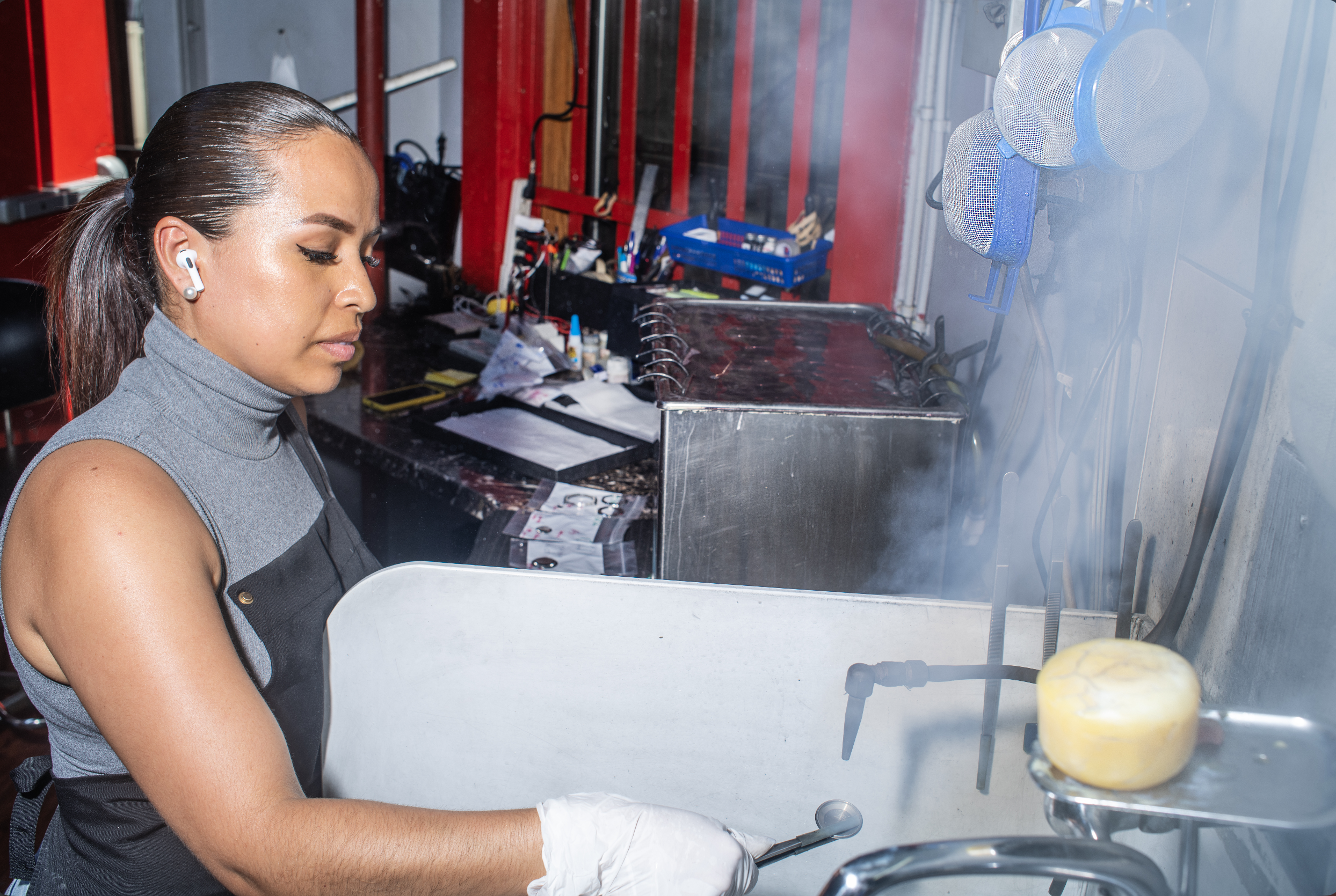Polisher steams a ring inside a 47th Street workshop