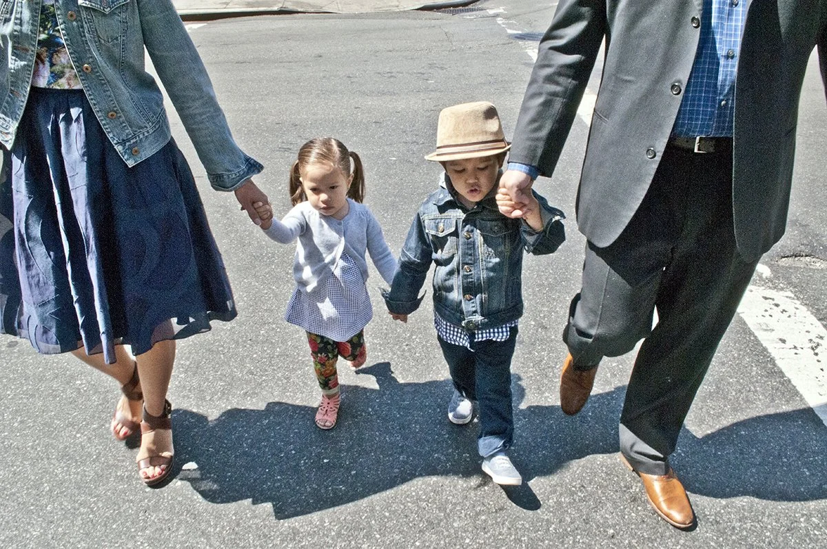 Family portraits shot in the street by Angela Cappetta. Shot in on location in Chelsea, NYC.