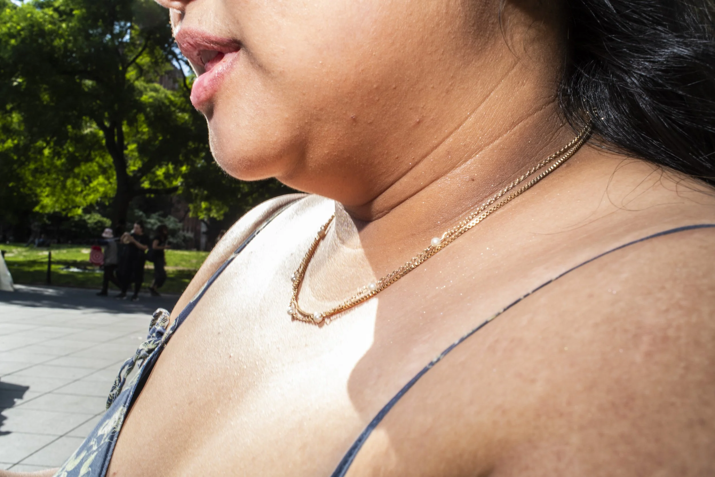 Portrait of a woman wearing a gold necklace shot in Manhattan