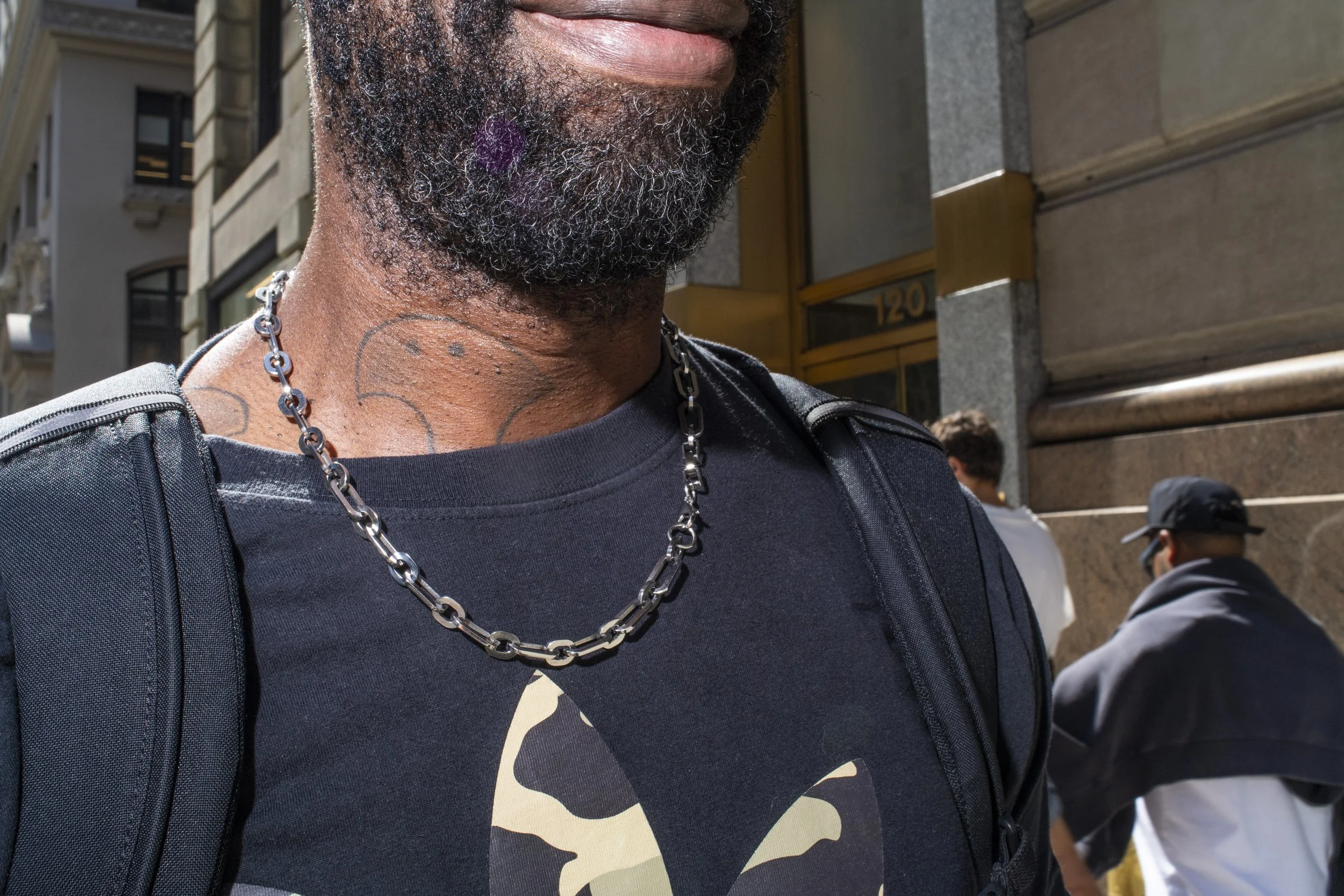 Man wearing a chain necklace  in New York City