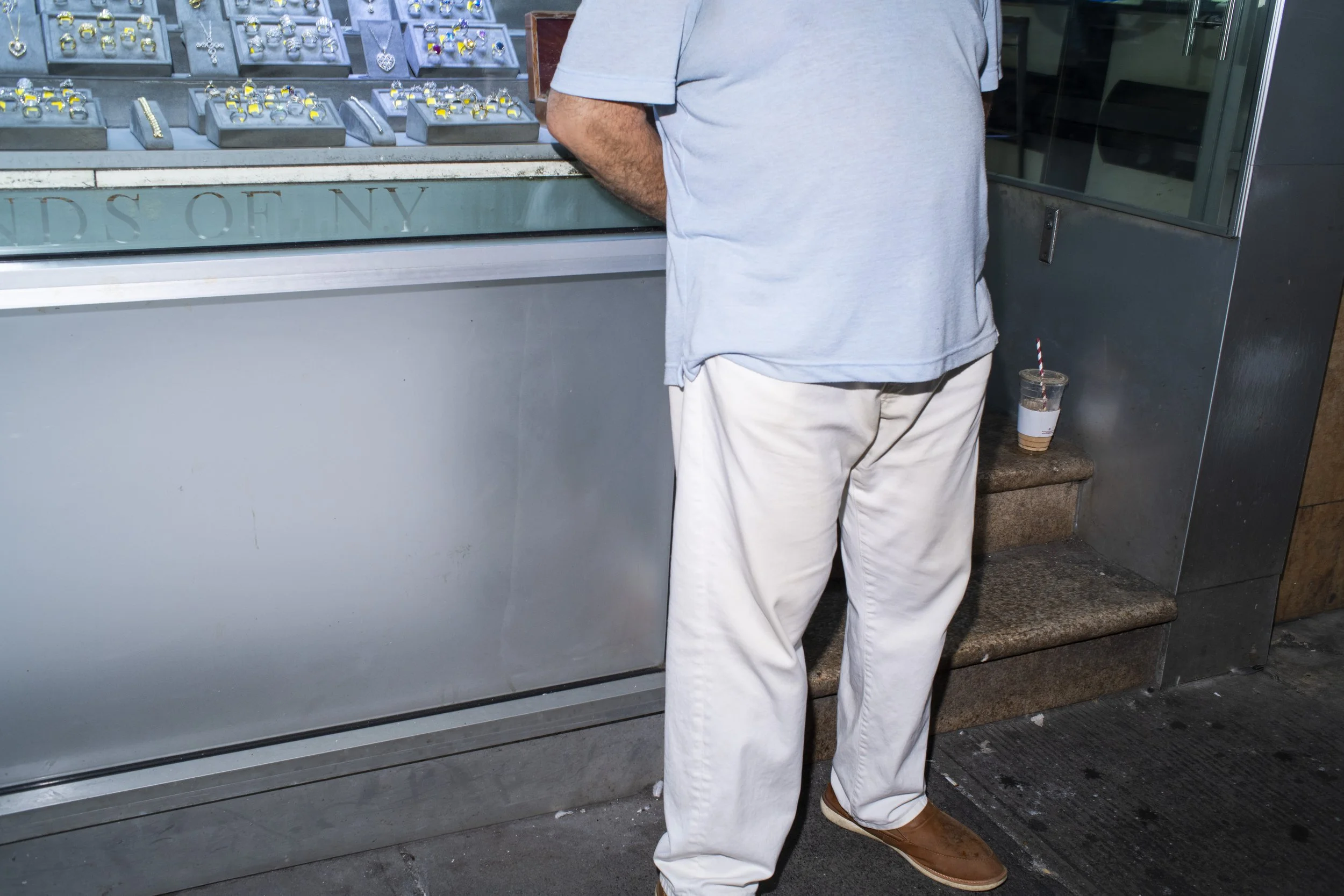 Doorman outside of a jewelry business on 47th Street