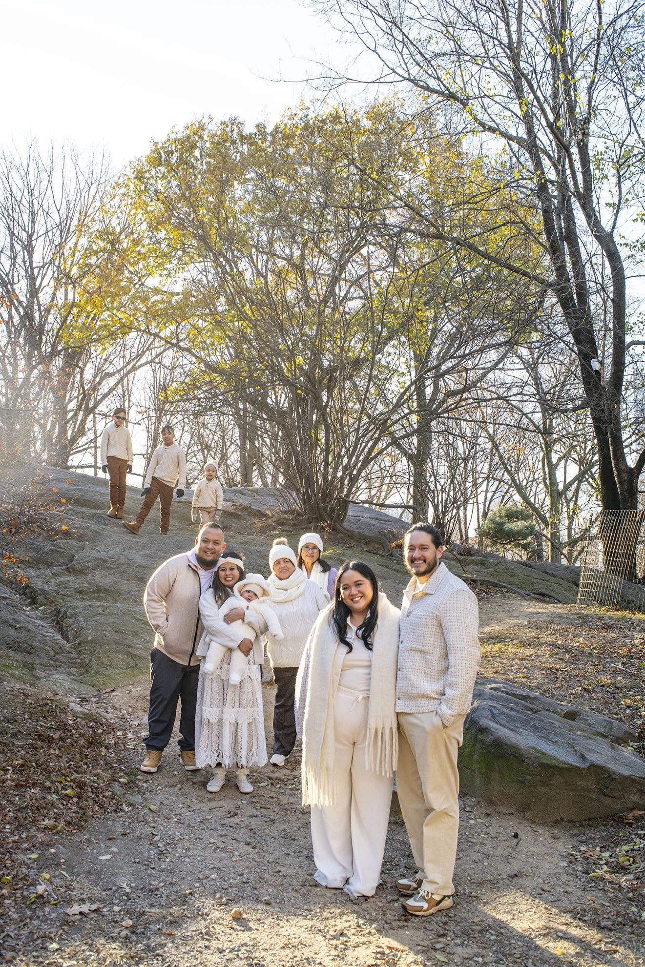 Three generations of a family gather among the autumn colors on Central Park's famous rocks.