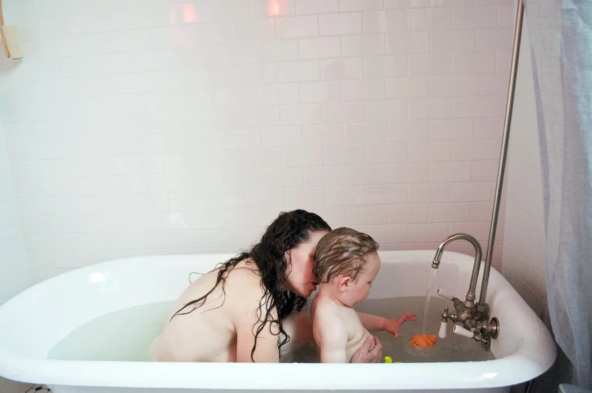 Mom and baby family portraits shot in the tub at home by Angela Cappetta. Shot in on location in Brooklyn, NY.