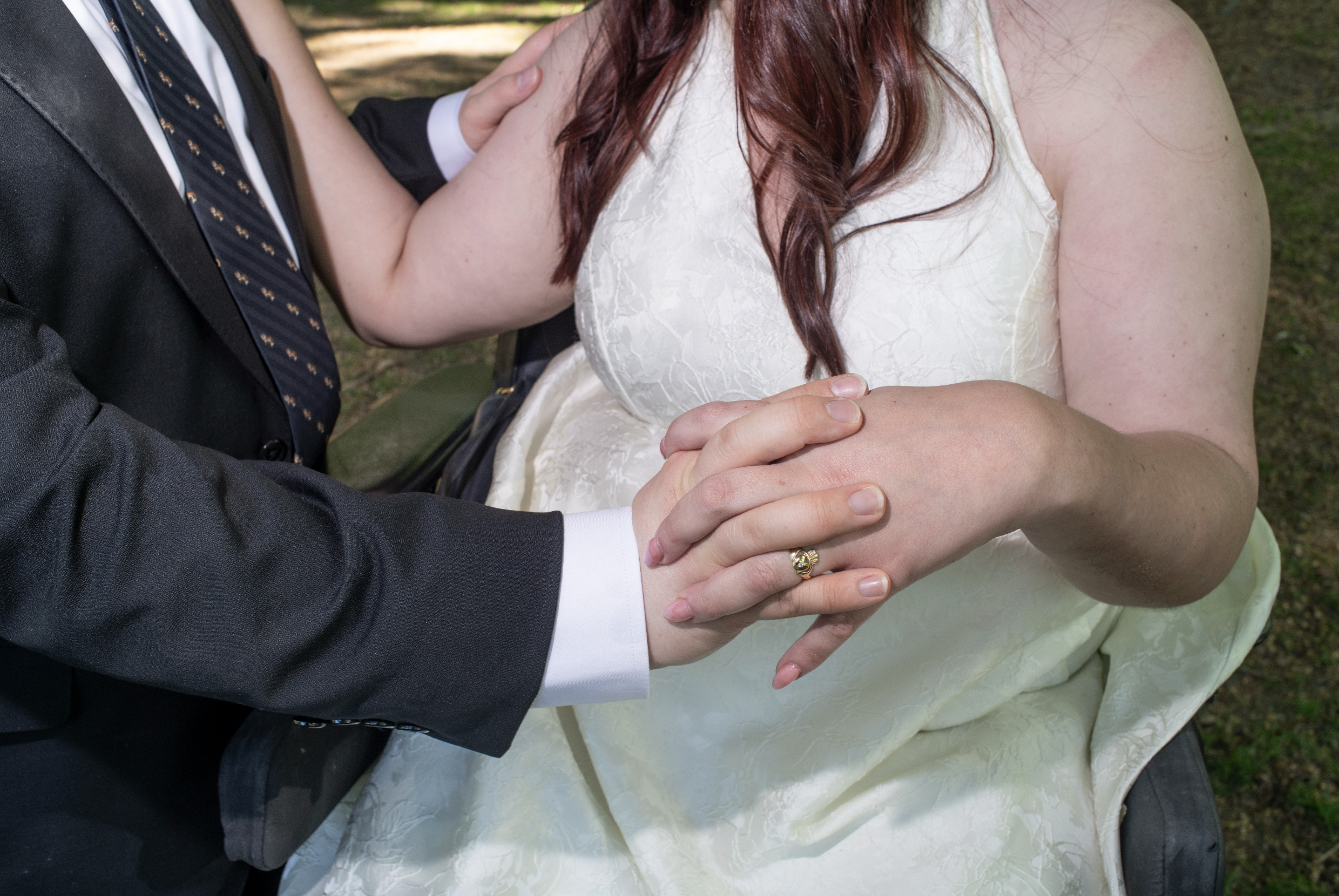 Couple during Central Park engagement session with bride wearing groom’s grandmother’s engagement ring