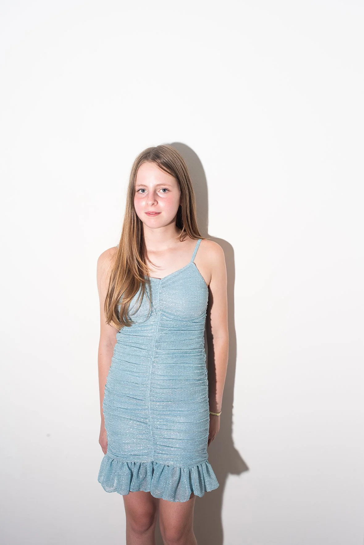 A studio portrait of a teenager photographed for her Bat Mitzvah, capturing her confidence, personality, and this meaningful milestone.