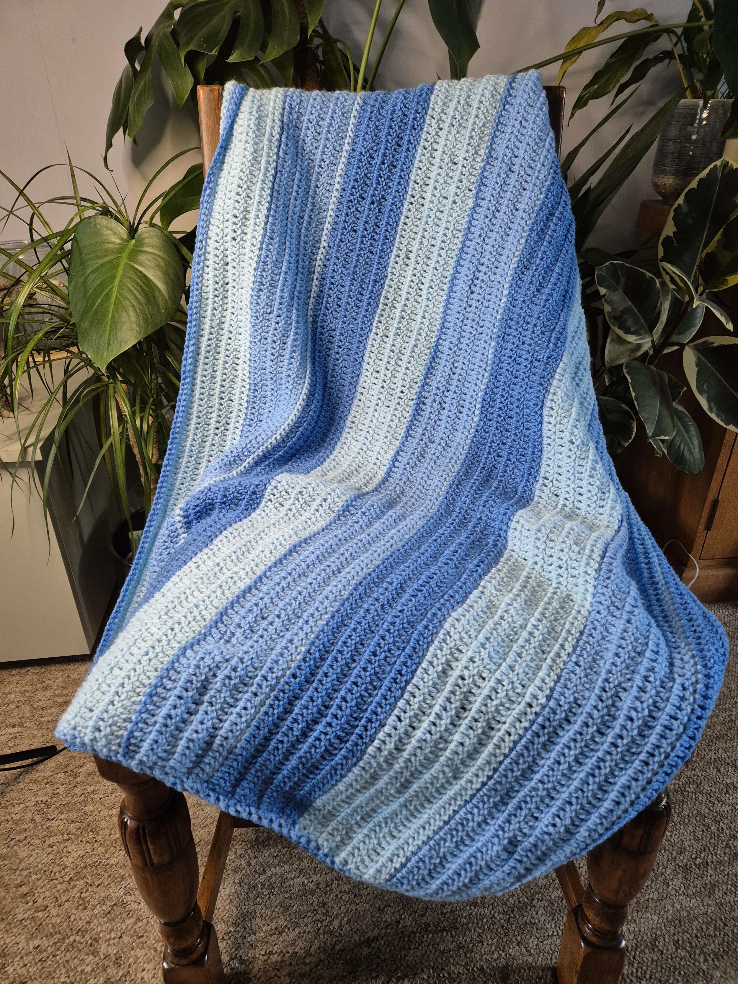 Crochet baby blanket in 3 soft shades of blues