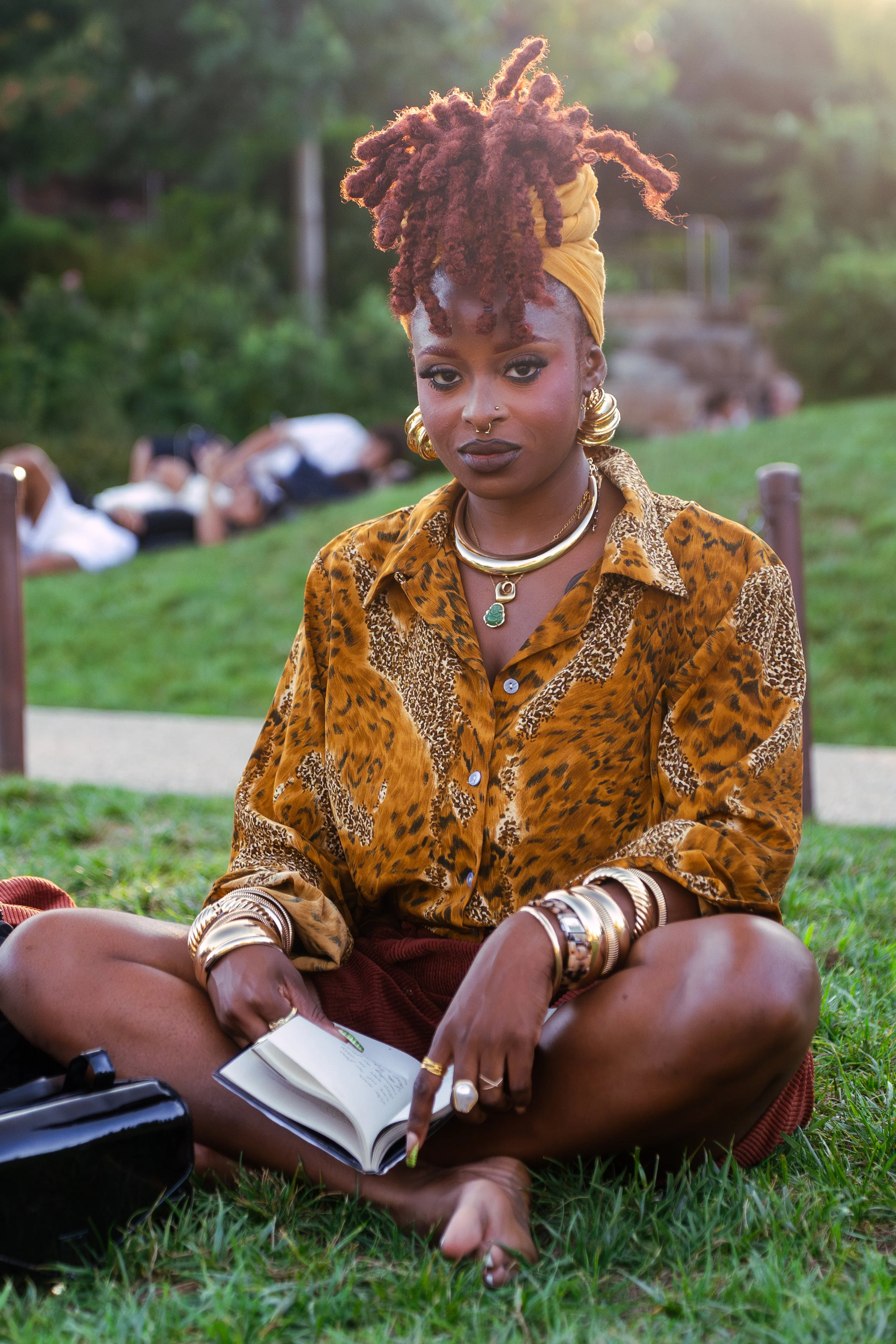Black Woman in park at pier 54 in New York City.