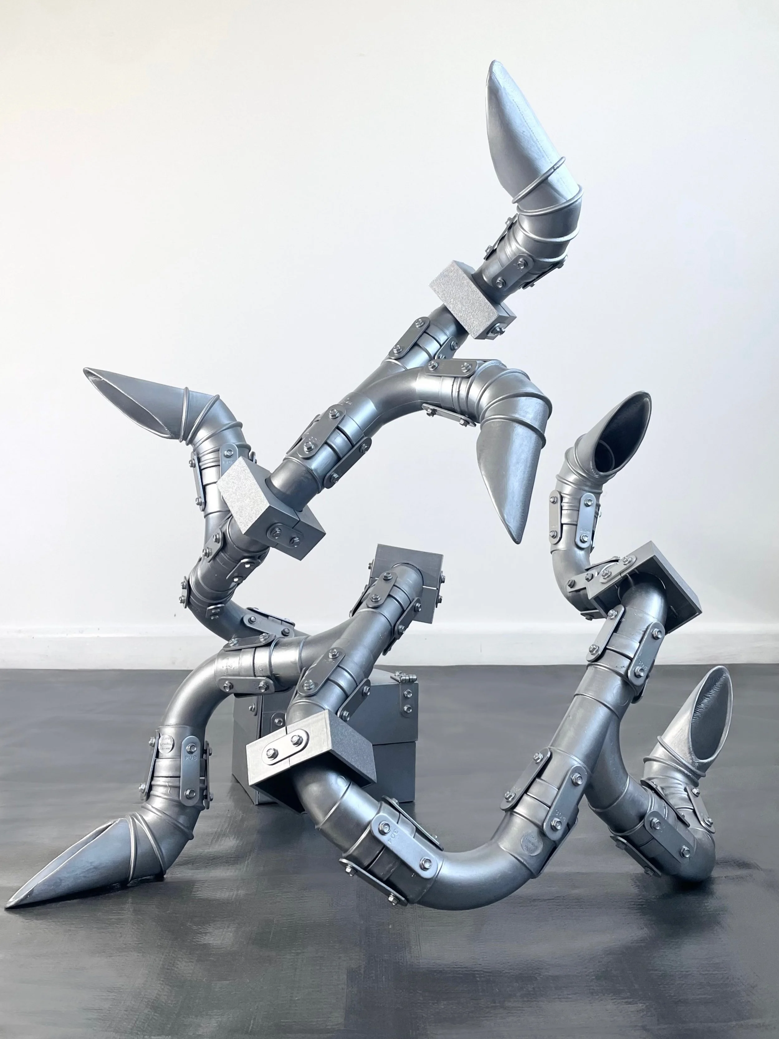 Susurrus Loop &mdash; sound sculpture (2026)
51 &times; 66 &times; 62 cm

Reclaimed Polypipe bends, 3D-printed PLA sections, automotive paint, horizontal ventilation ducting bends, metal plates, hinges, screws, and sound.

A sound composition emerges