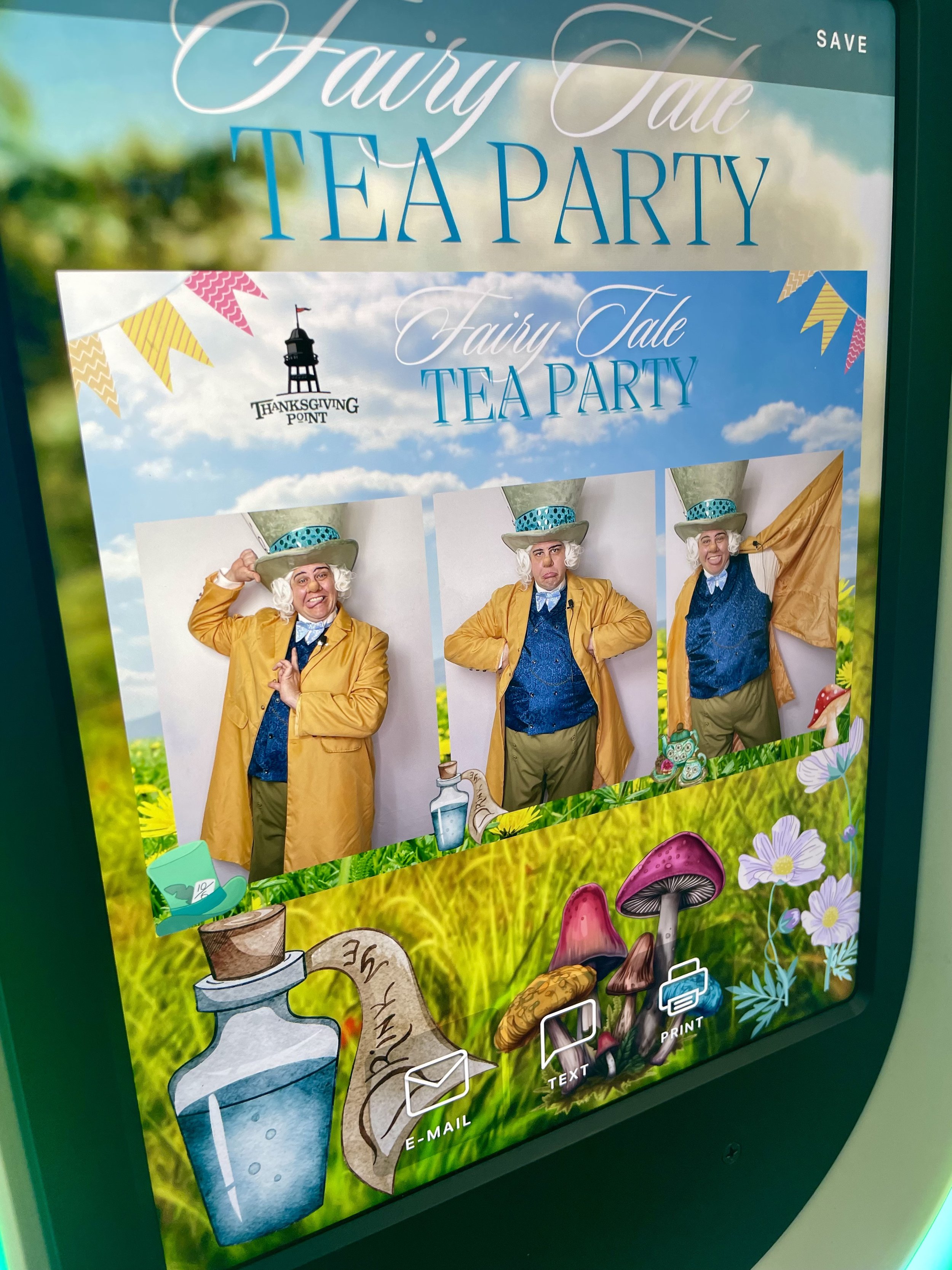 Interactive kiosk with a touchscreen displaying 'Tap to Start' and illuminated with orange and yellow lights.