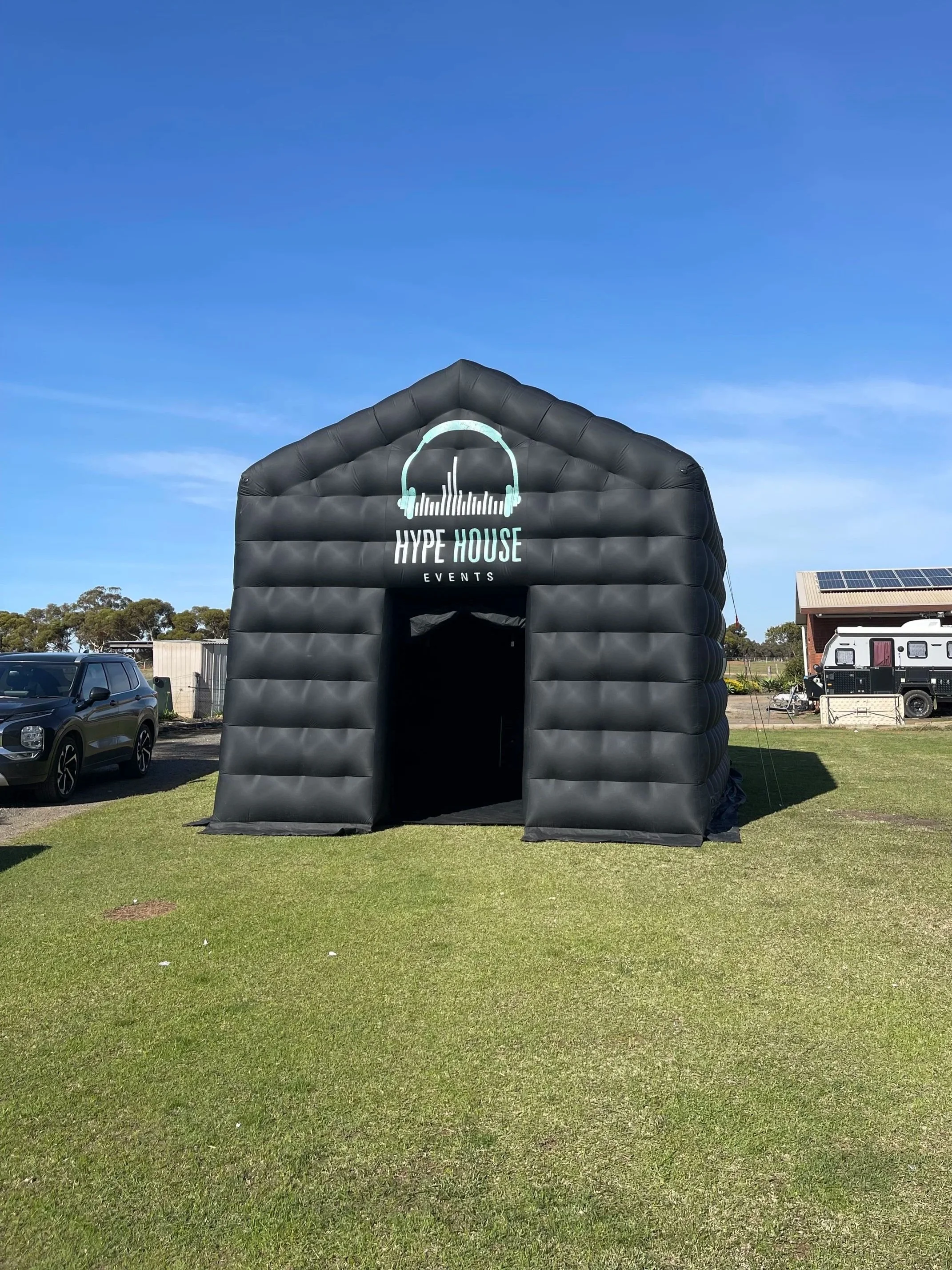 Inflatable nightclub party setup with disco lights, dj and dancefloor in a backyard event in Melbourne