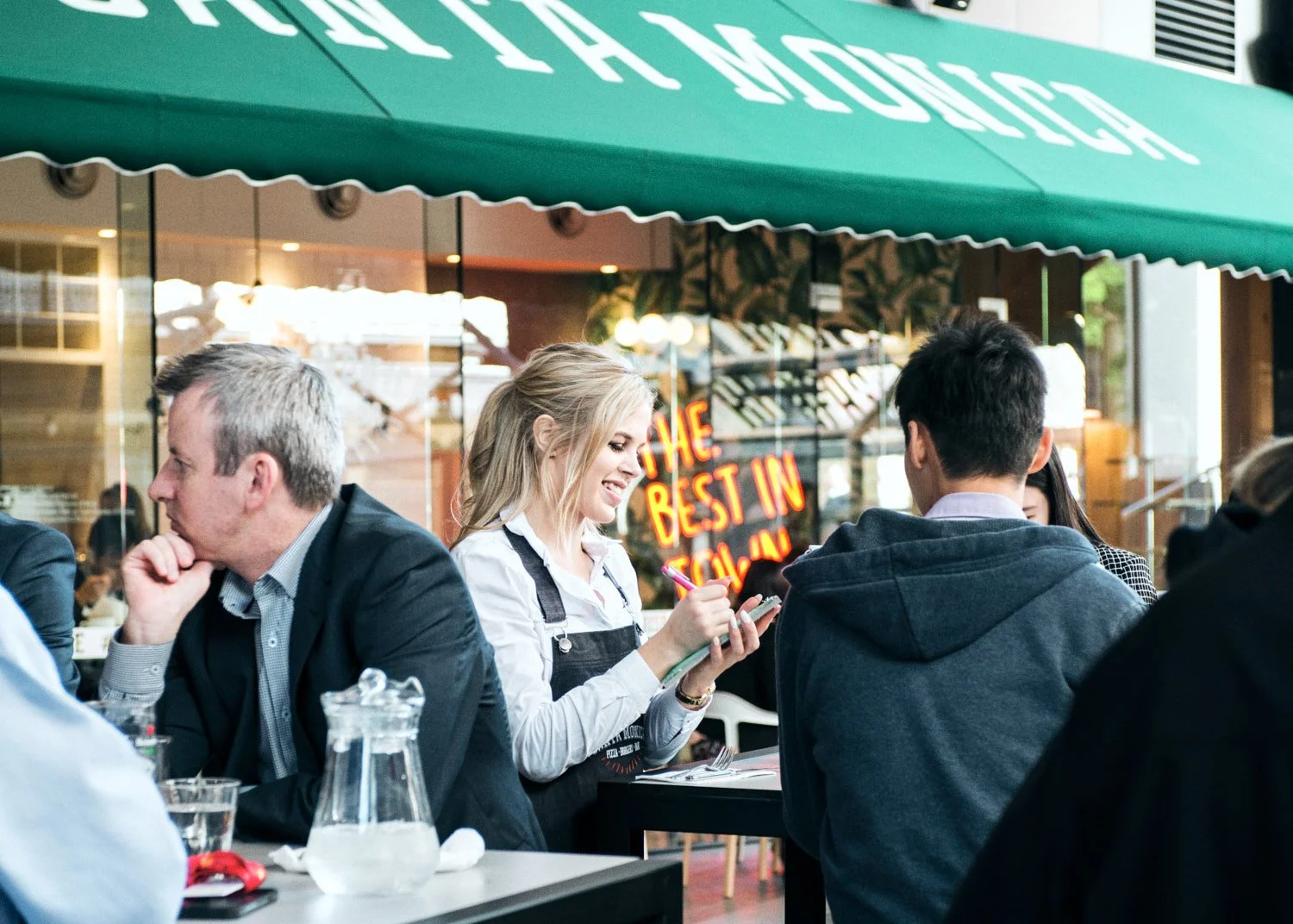 A commercial photograph of a busy Brisbane restaurant taken by Commercial food photographer Tom MacDonald of Tom Mac photography.