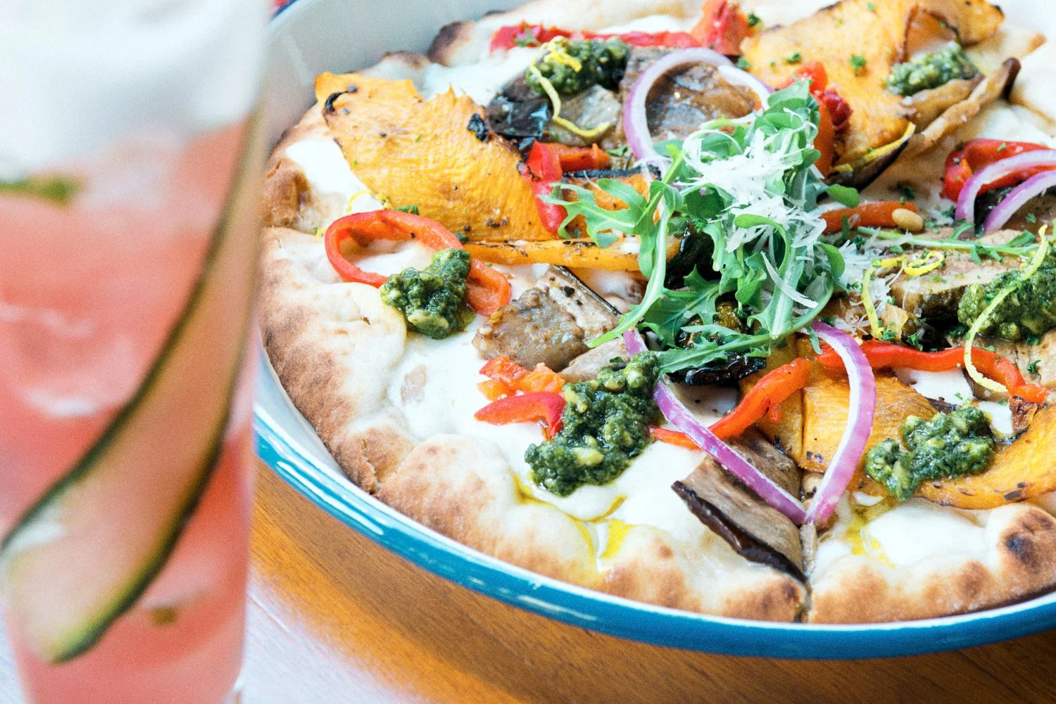 A commercial photograph of a pizza in a Brisbane business, taken by Commercial food photographer Tom MacDonald of Tom Mac photography.