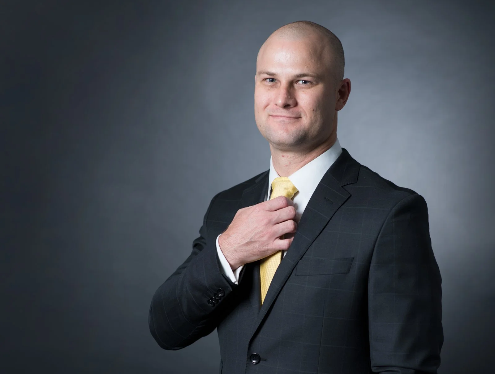 A playful commercial headshot of a  male lawyer in Brisbane taken by TomMac Photography