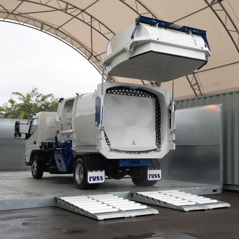A  gif created by Tom MacDonald of a truck parked on a metallic surface in Brisbane, equipped with a large white tank showing off the mechanism of the truck. 