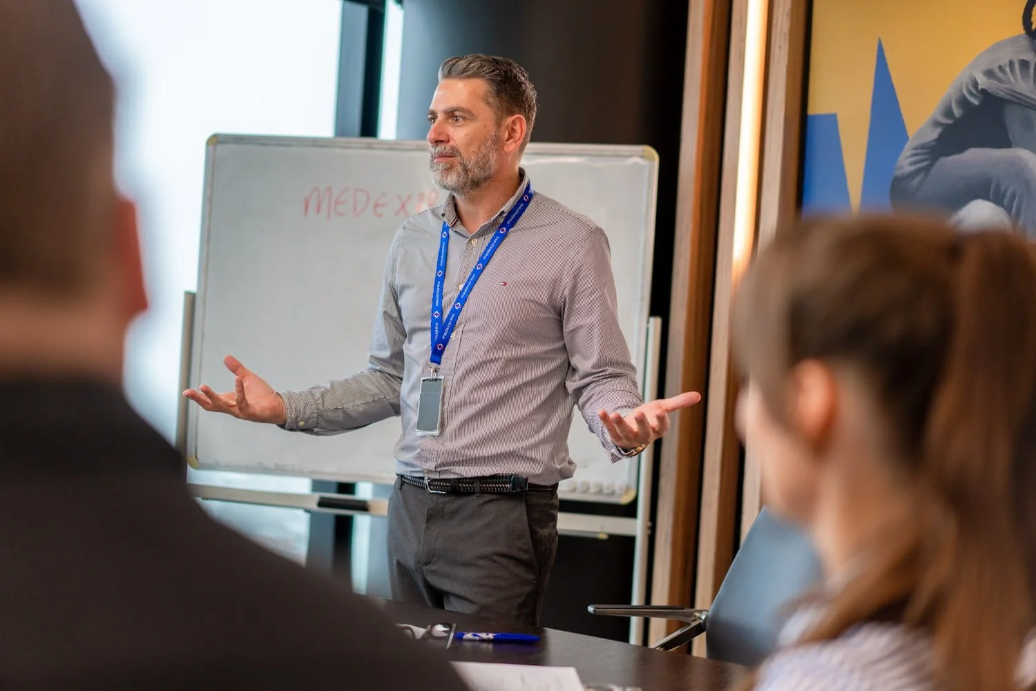 A commercial photograph of a man presenting to a group in Brisbane taken by commercial photographer Tom MacDonald.