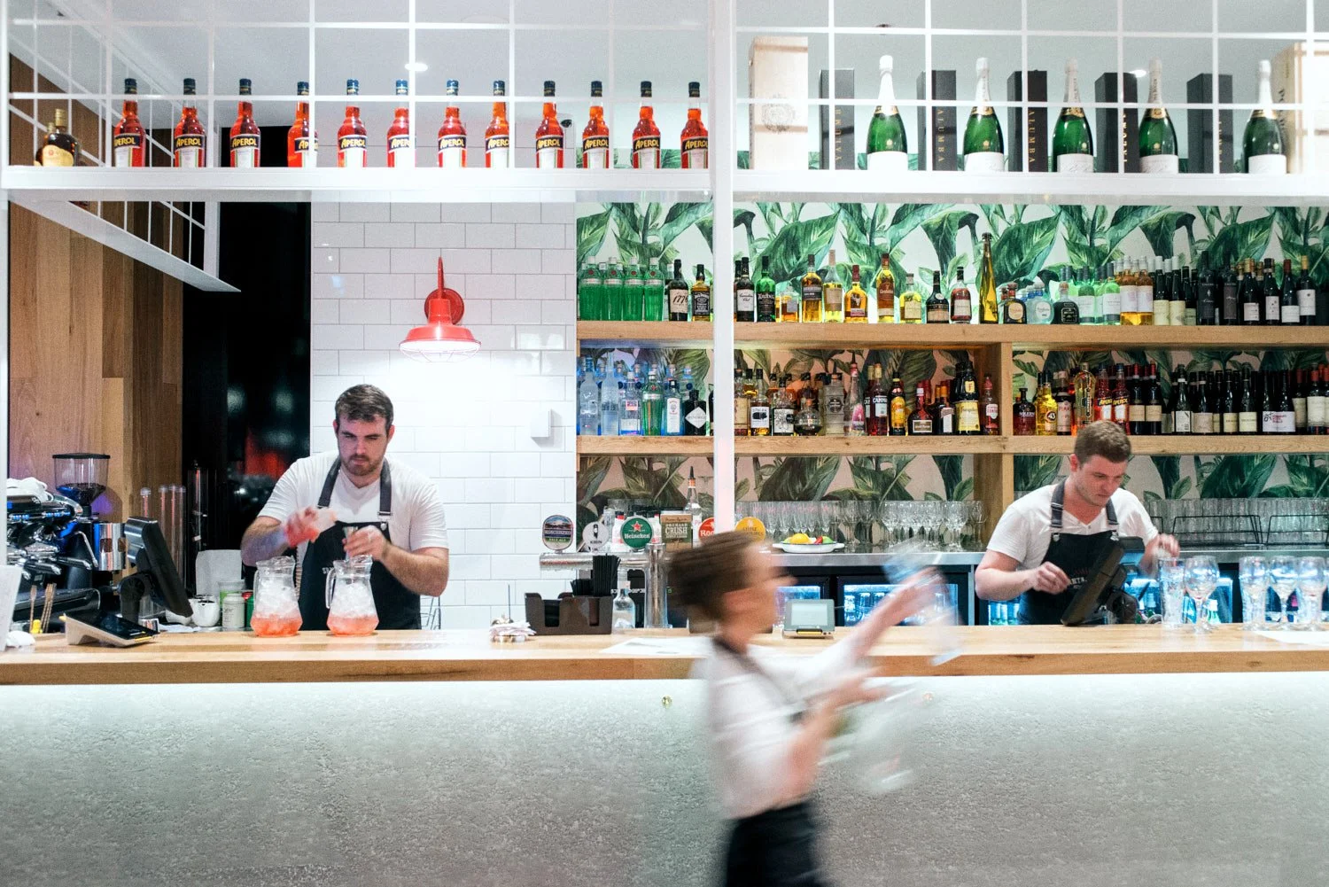 A commercial photo of staff at a bar. Taken by food photographer Tom MacDonald of Tom Mac photography.