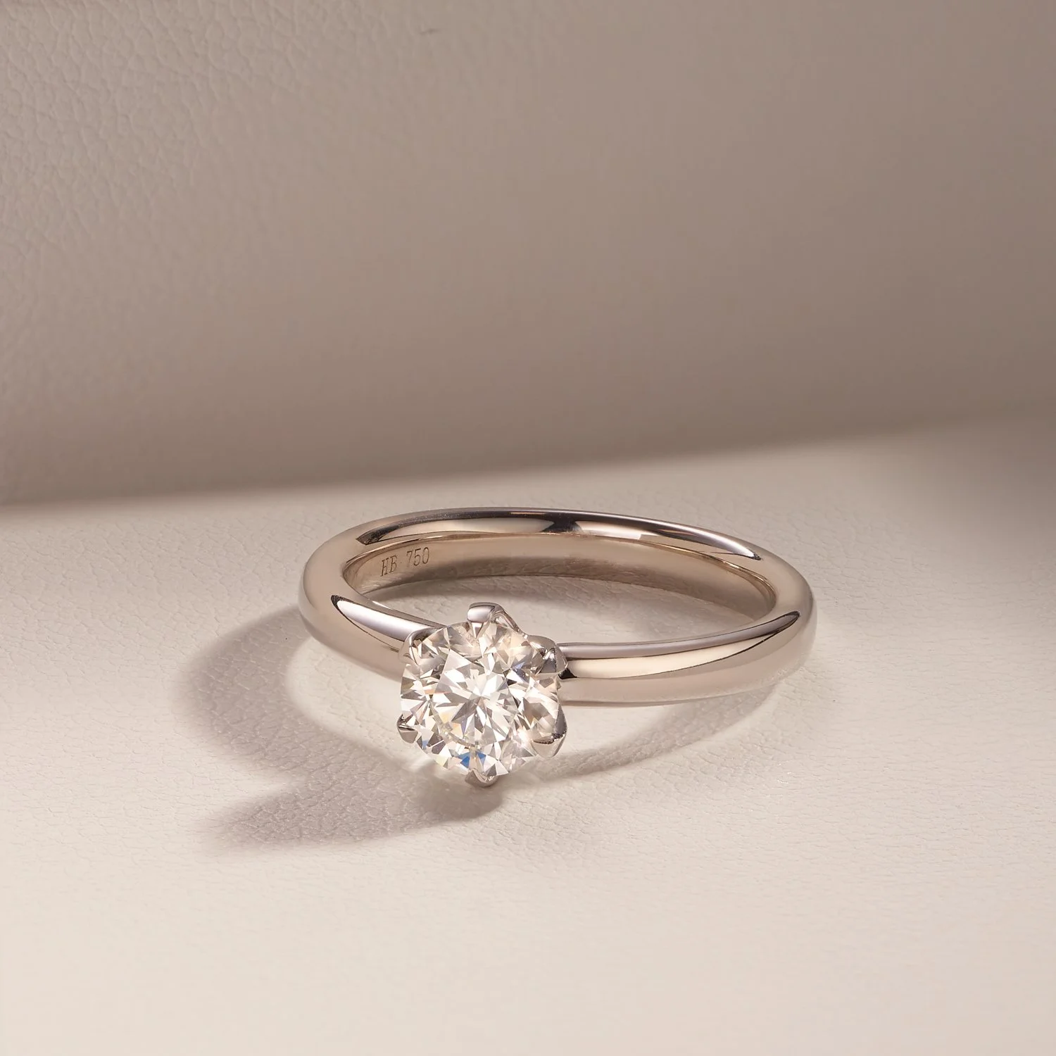 A  commercial jewellery photograph of a  white gold ring with a diamond solitaire setting taken by Brisbane based commercial photographer Tom MacDonald for Hardy brothers jewellers.