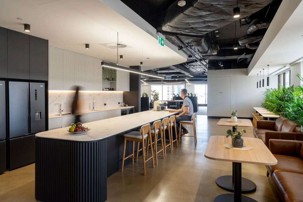 A commercial interior image of Modern kitchen and lounge area in an office in Brisbane taken by Tom MacDonald