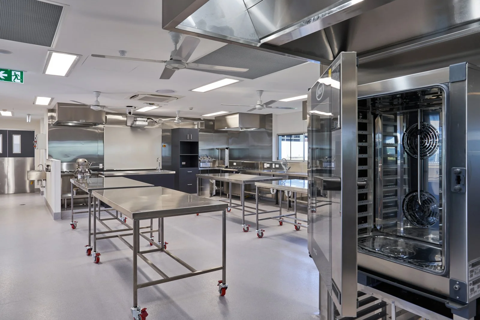 A commercial image of empty commercial kitchen taken to show the quality of work by the design and building team. Taken By photographer  Tom MacDonald in Ipswich Queensland