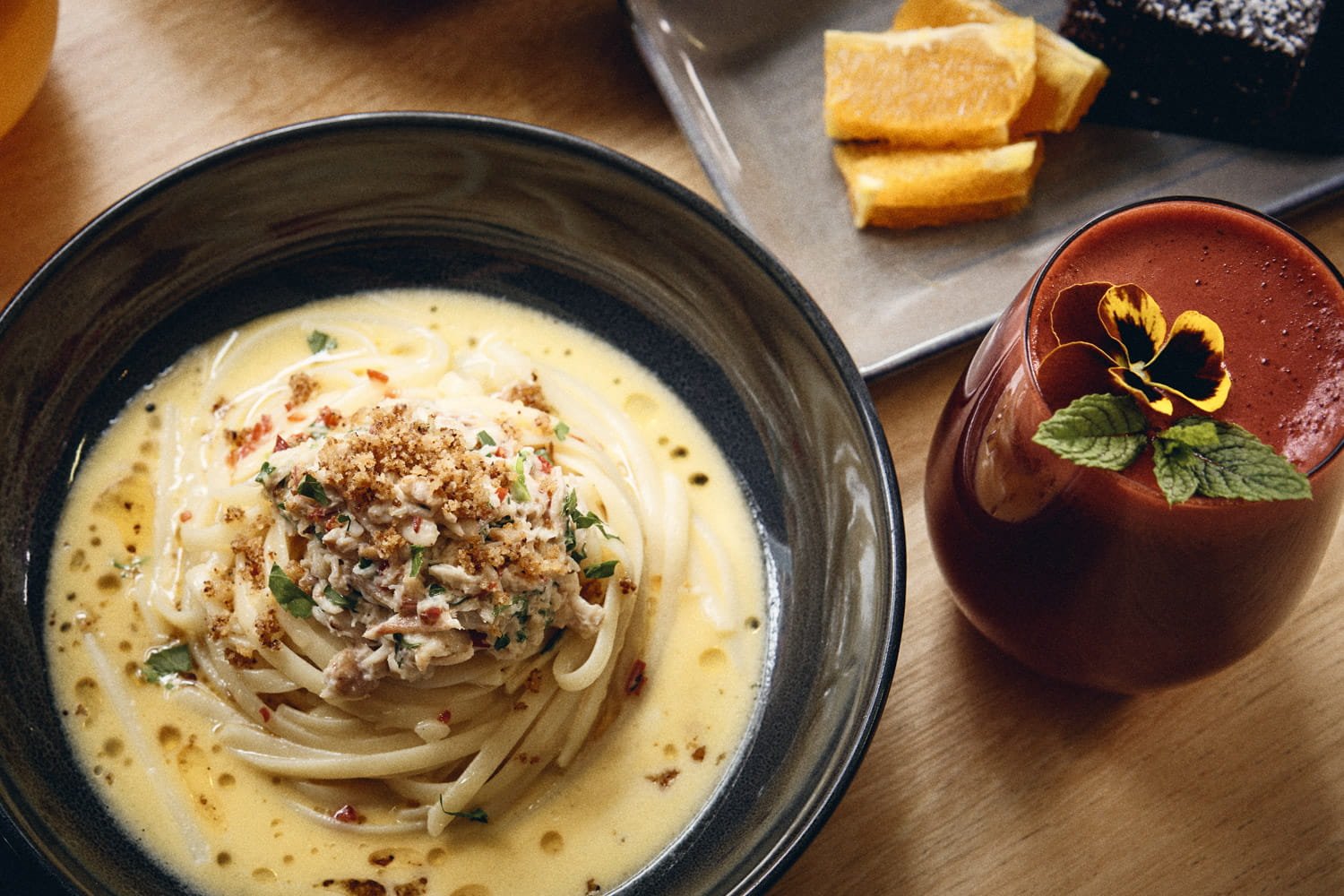 A commercial food image of delishious food on a table, taken by Brisbane based commercial photographer Tom MacDonald of Tom Mac photography.