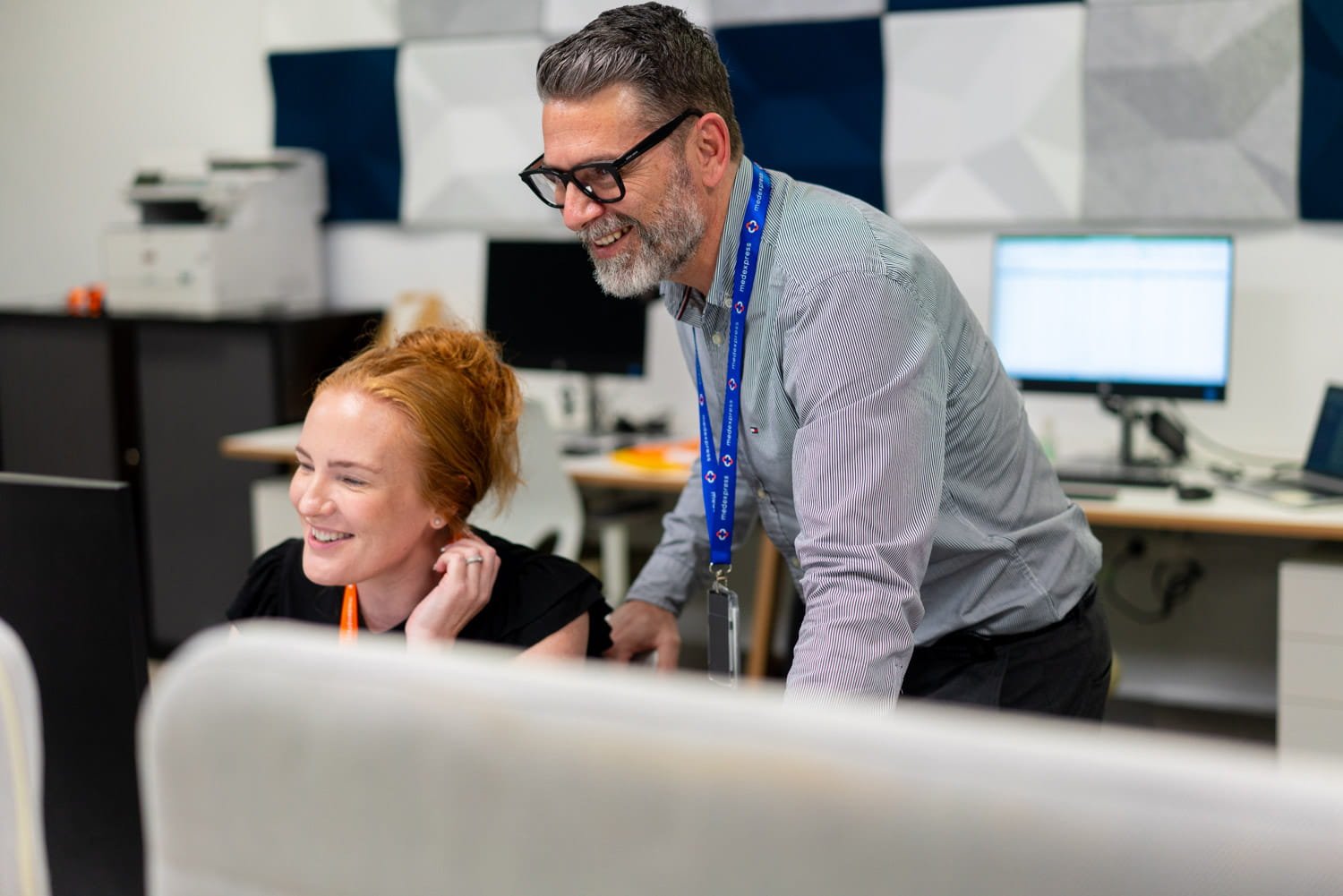 A commercial image of office workers in Brisbane taken by commercial headshot photographer Tom MacDonald.