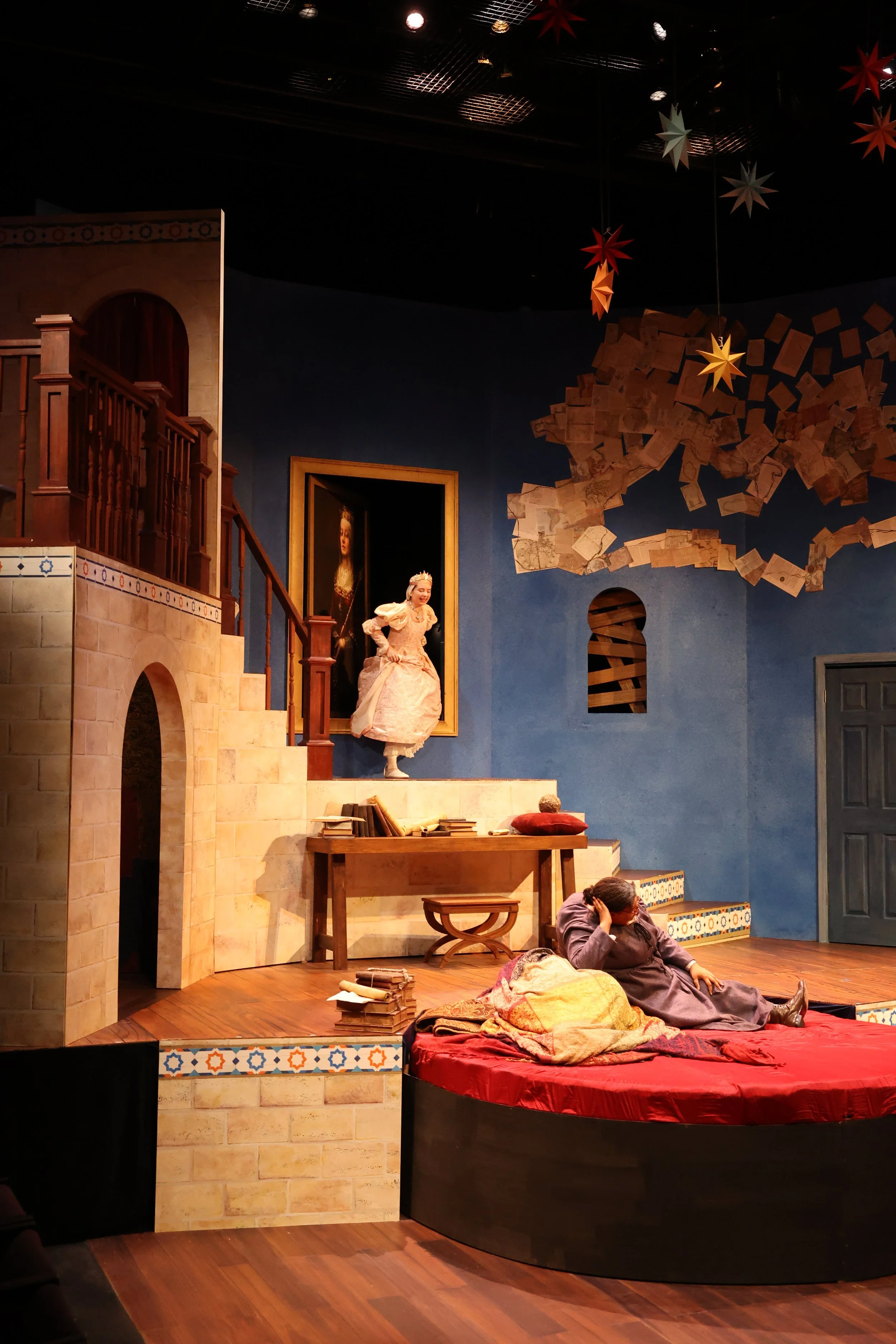 Infanta Juana enters through the hidden painting door. 
